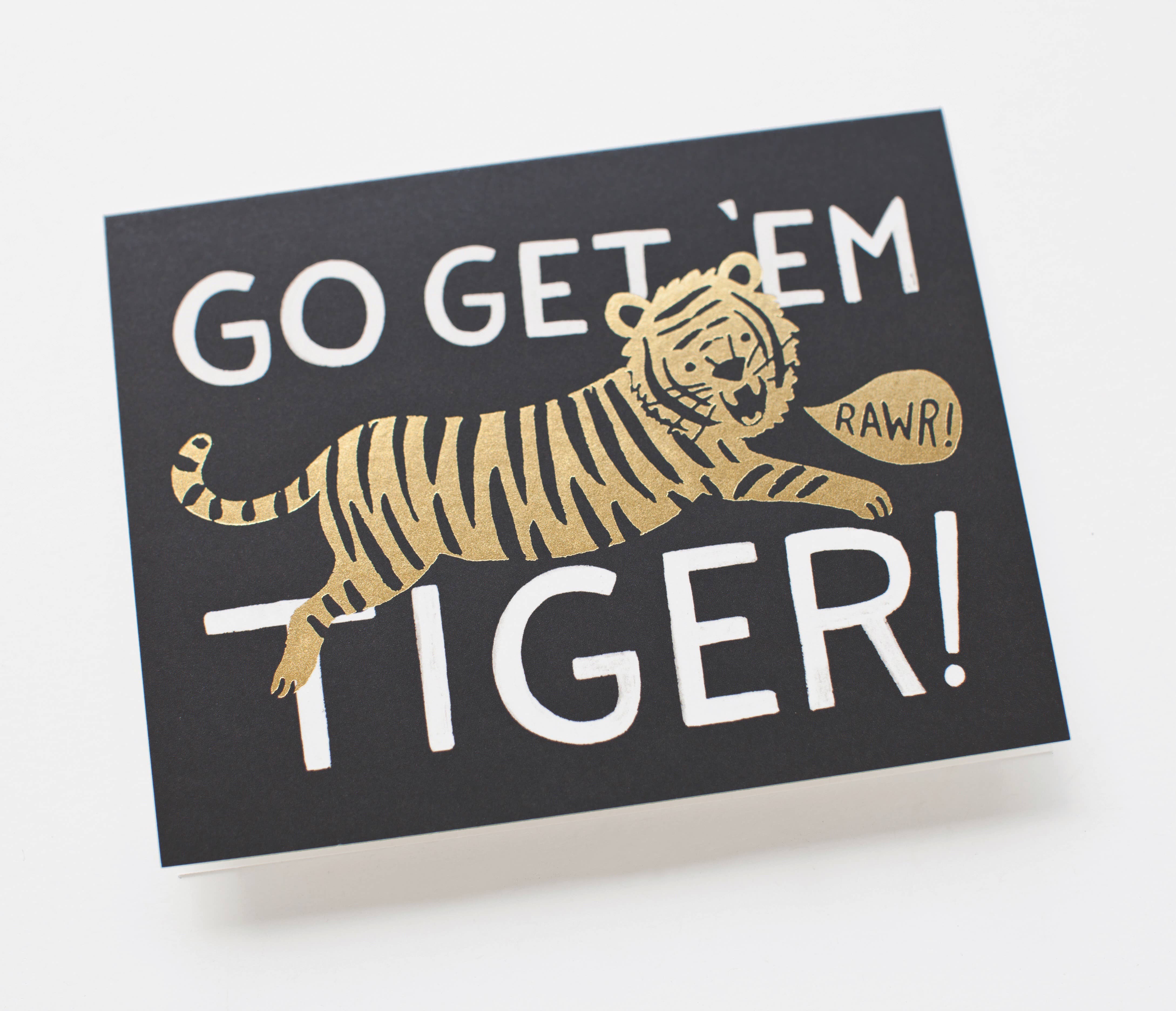 "Go Get 'Em Tiger" greeting card with a leaping illustrated tiger and bold typography, paired with a white envelope.