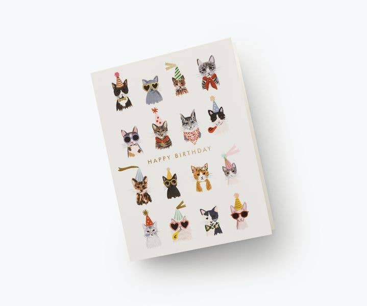A birthday card featuring stylish illustrations of cats wearing party hats, sunglasses, and bowties, paired with a gold envelope.