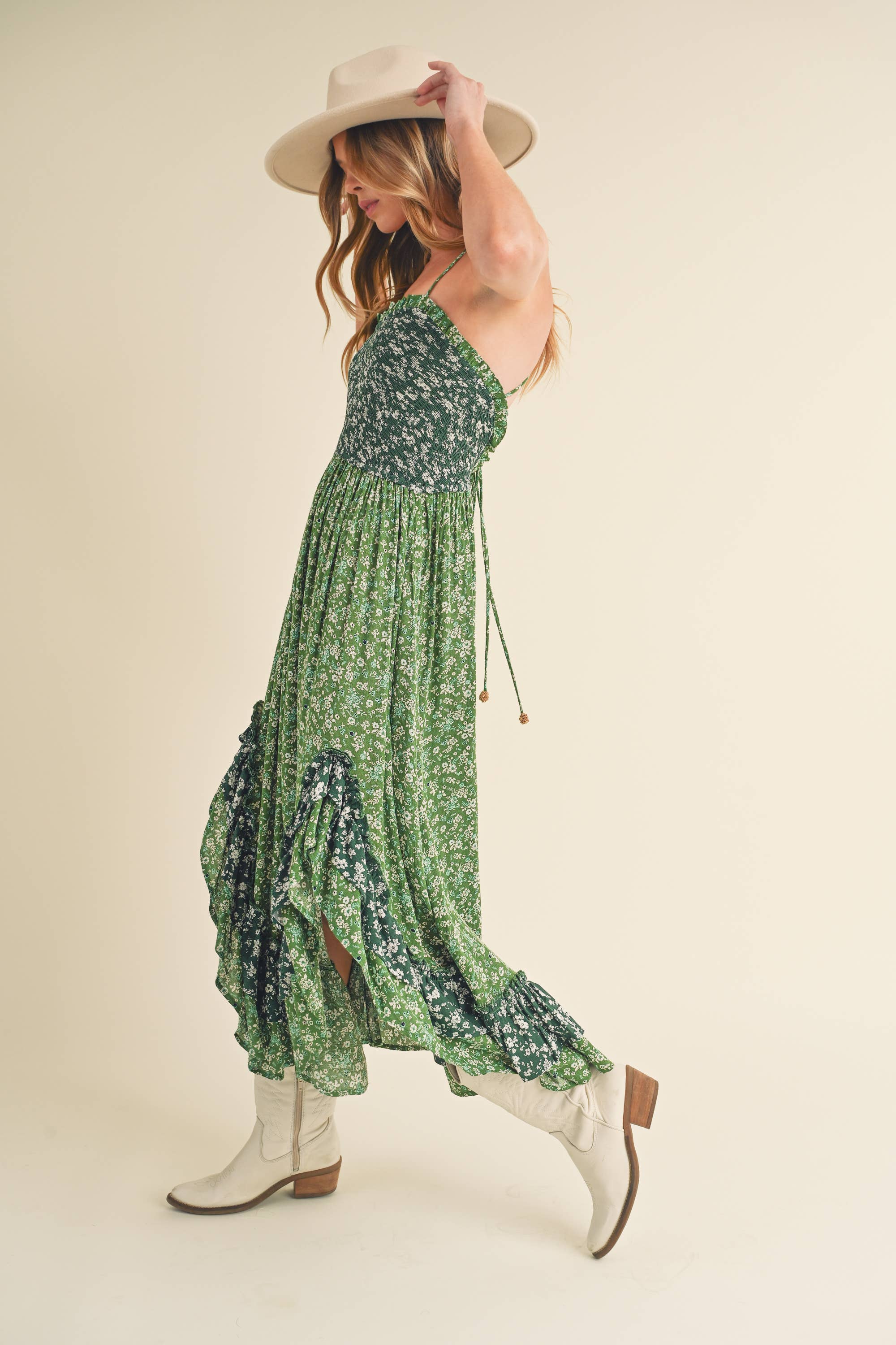 Panoramic view of the enchanting Deeane Ruffle Dress in vibrant green with floral pattern.