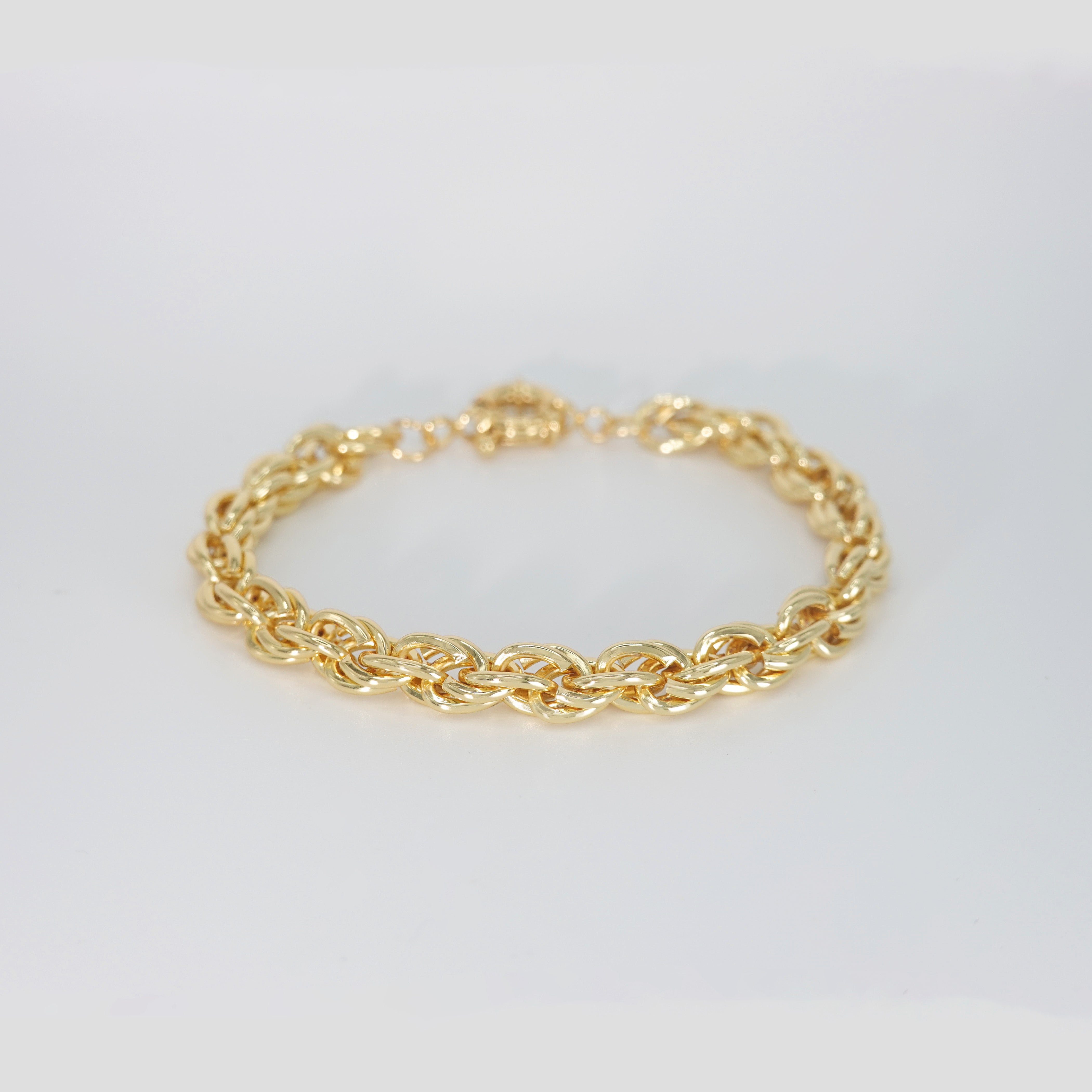 Lily Bracelet: Delicate gold chain bracelet with colorful gemstones.