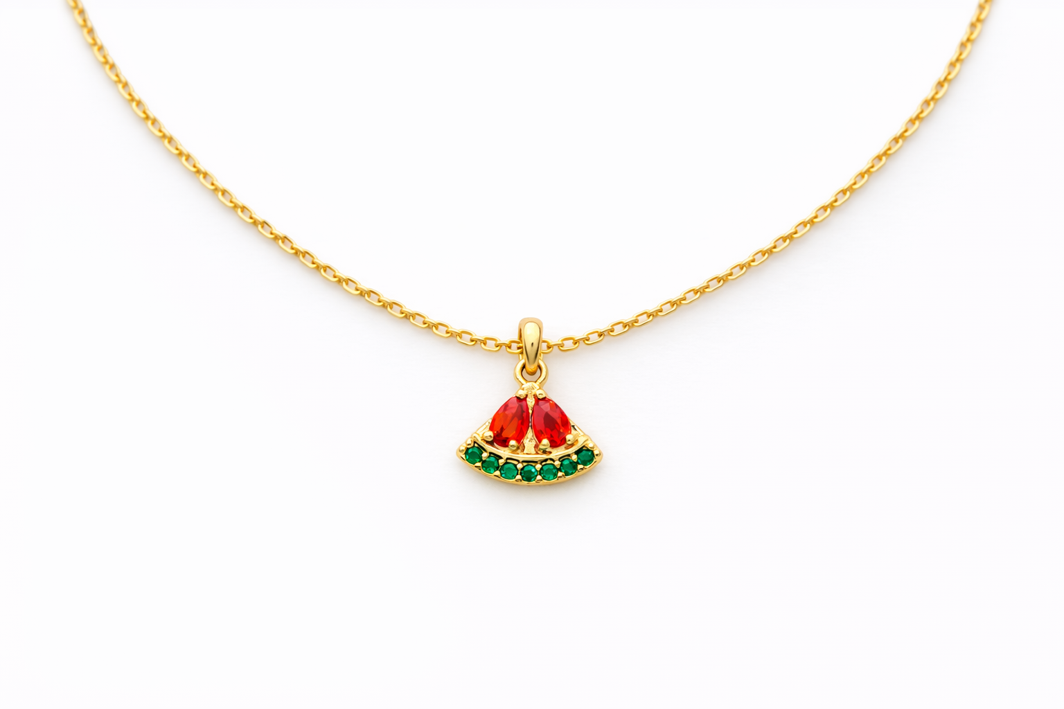 Gold necklace with a watermelon pendant on a white background