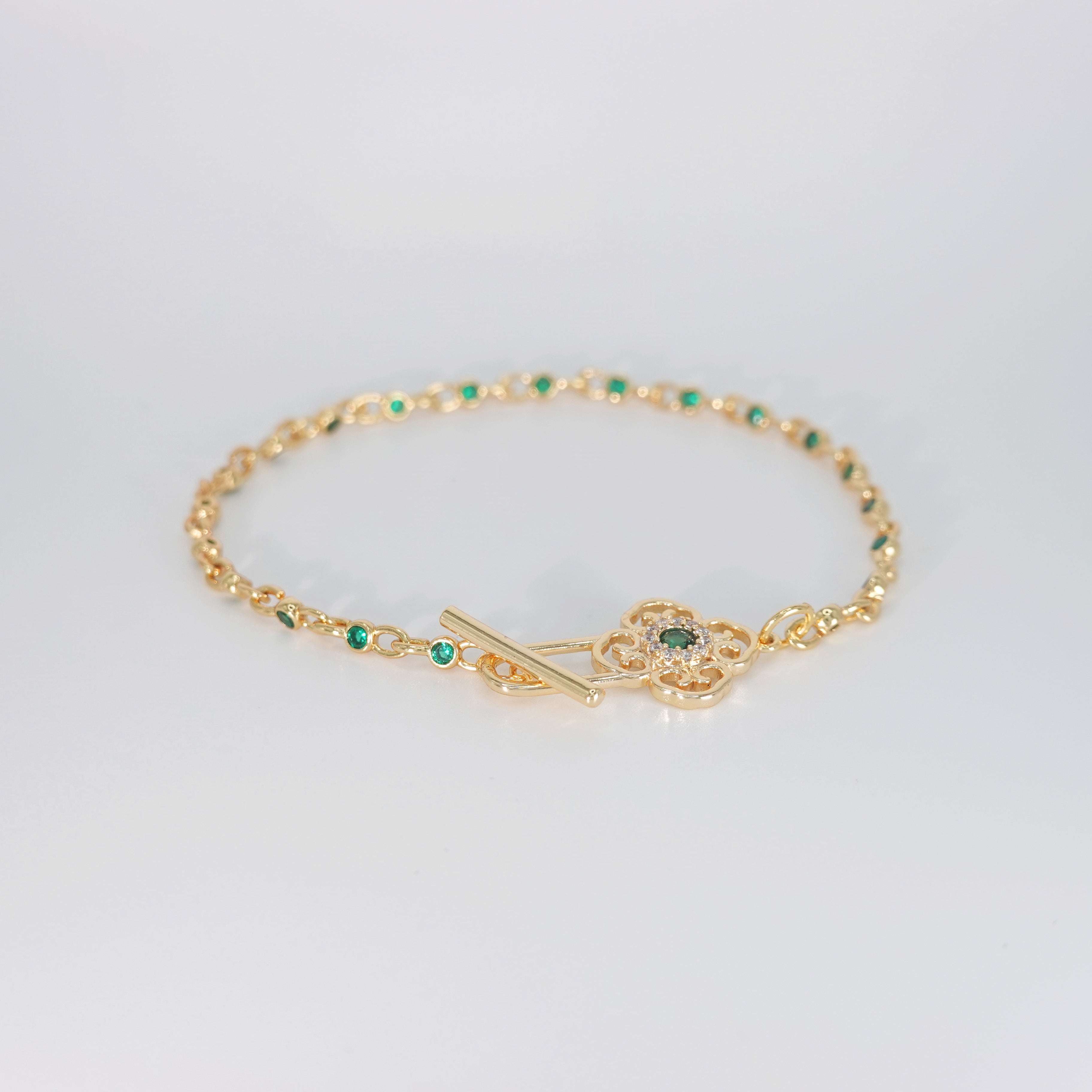Lotus Bracelet: Shimmering stones encircling a serene green centerpiece, epitome of elegance and tranquility.