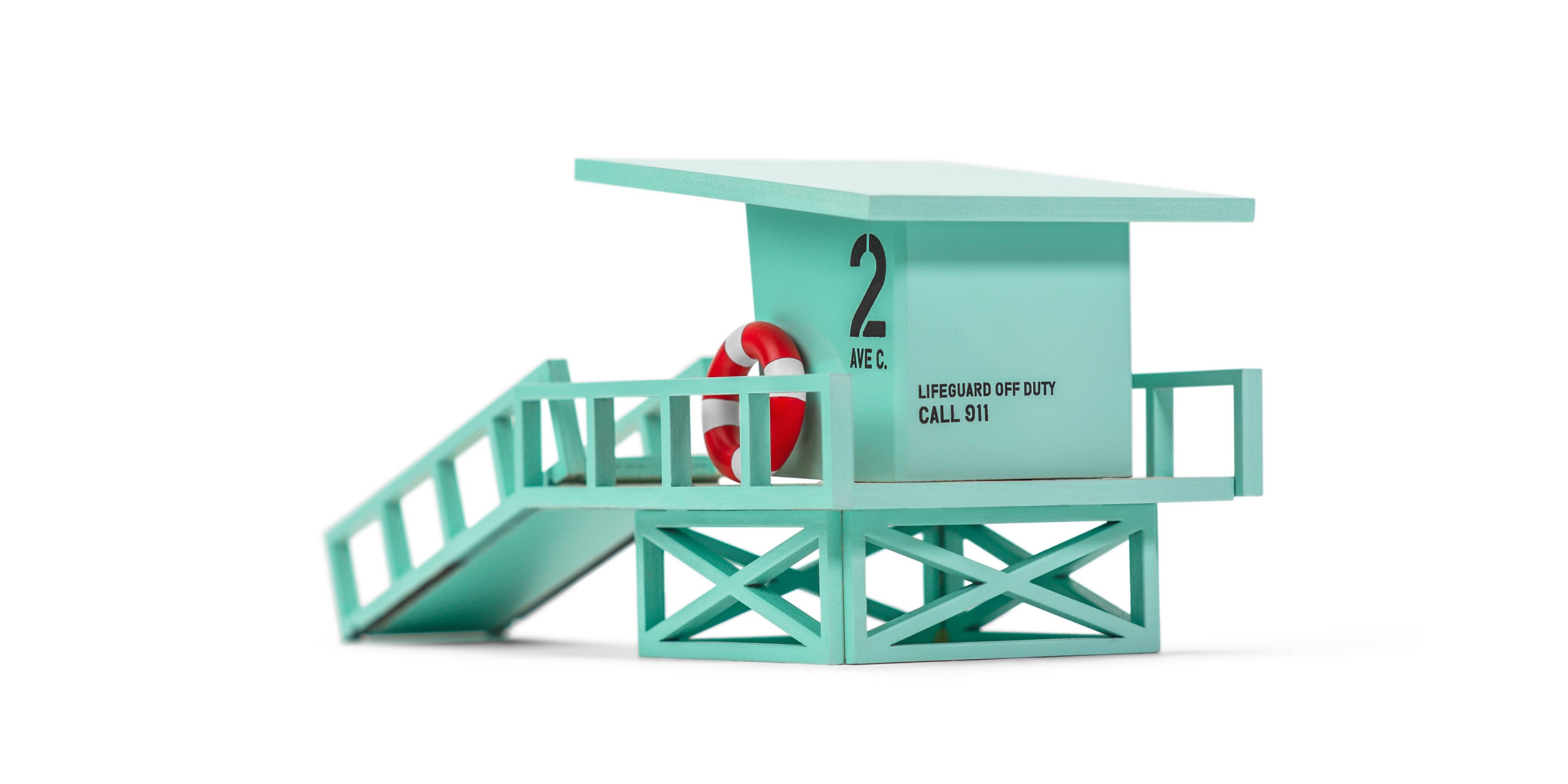 Toy lifeguard stand with a figure on a white background