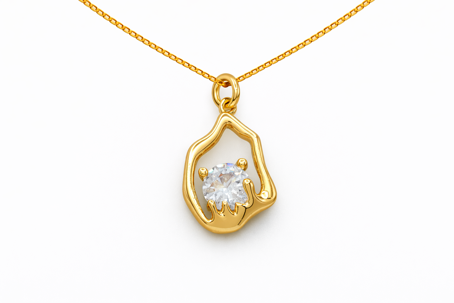 Gold pendant with a diamond on a white background