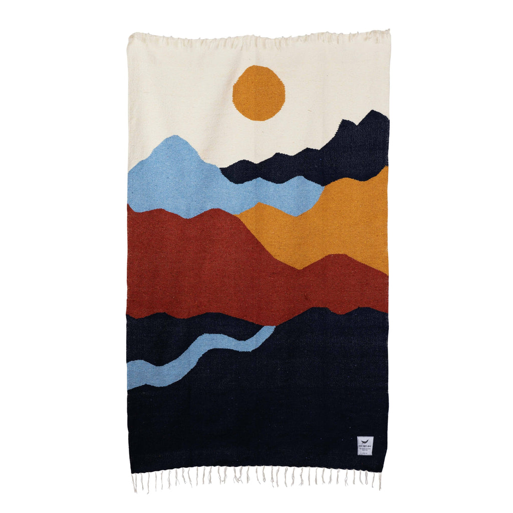 Mountains Throw Blanket: Cozy blanket with stunning mountain landscape design, epitome of warmth and wilderness.