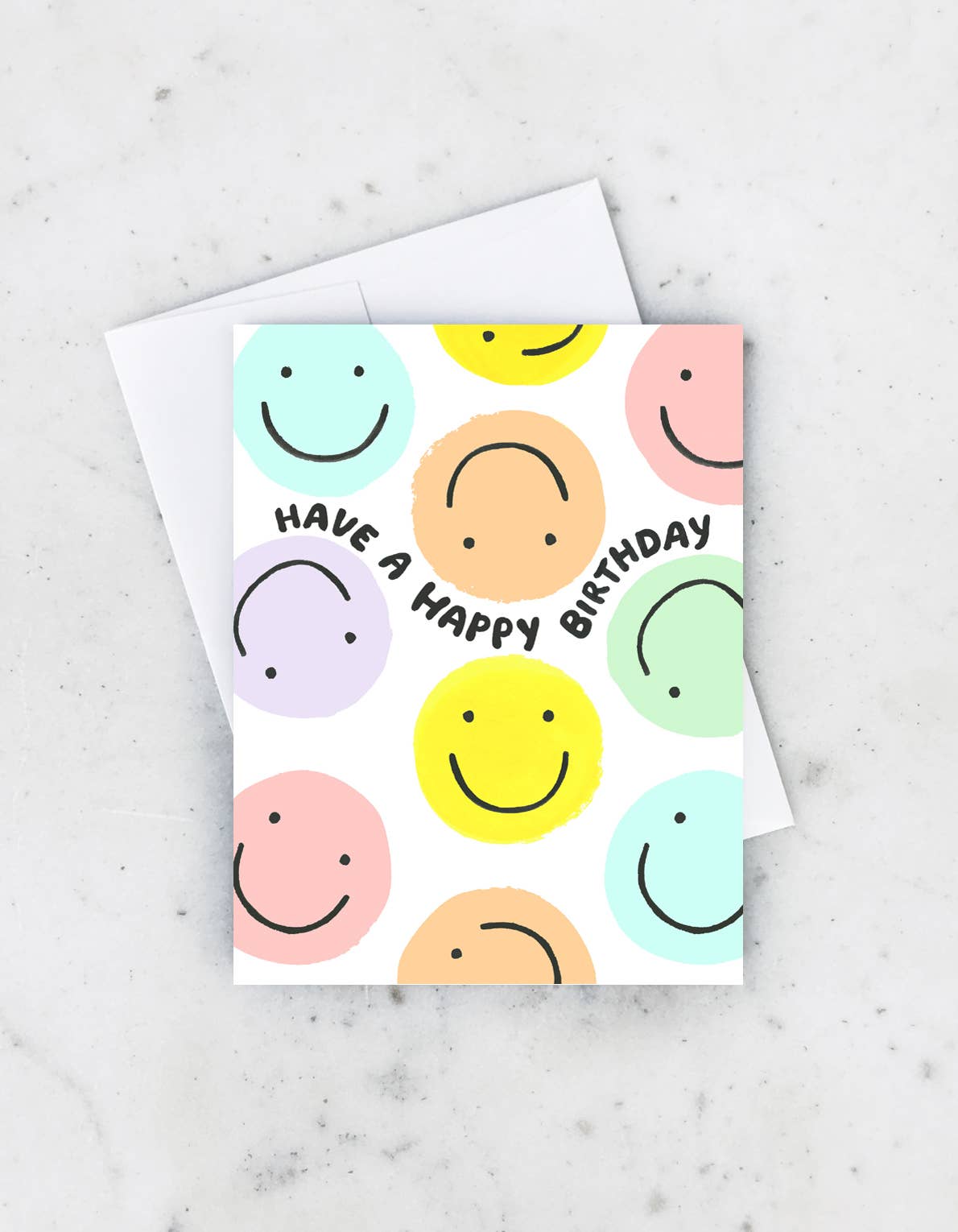 Colorful greeting card with pastel smiley and frowny faces and the text "Have a Happy Birthday" in black.