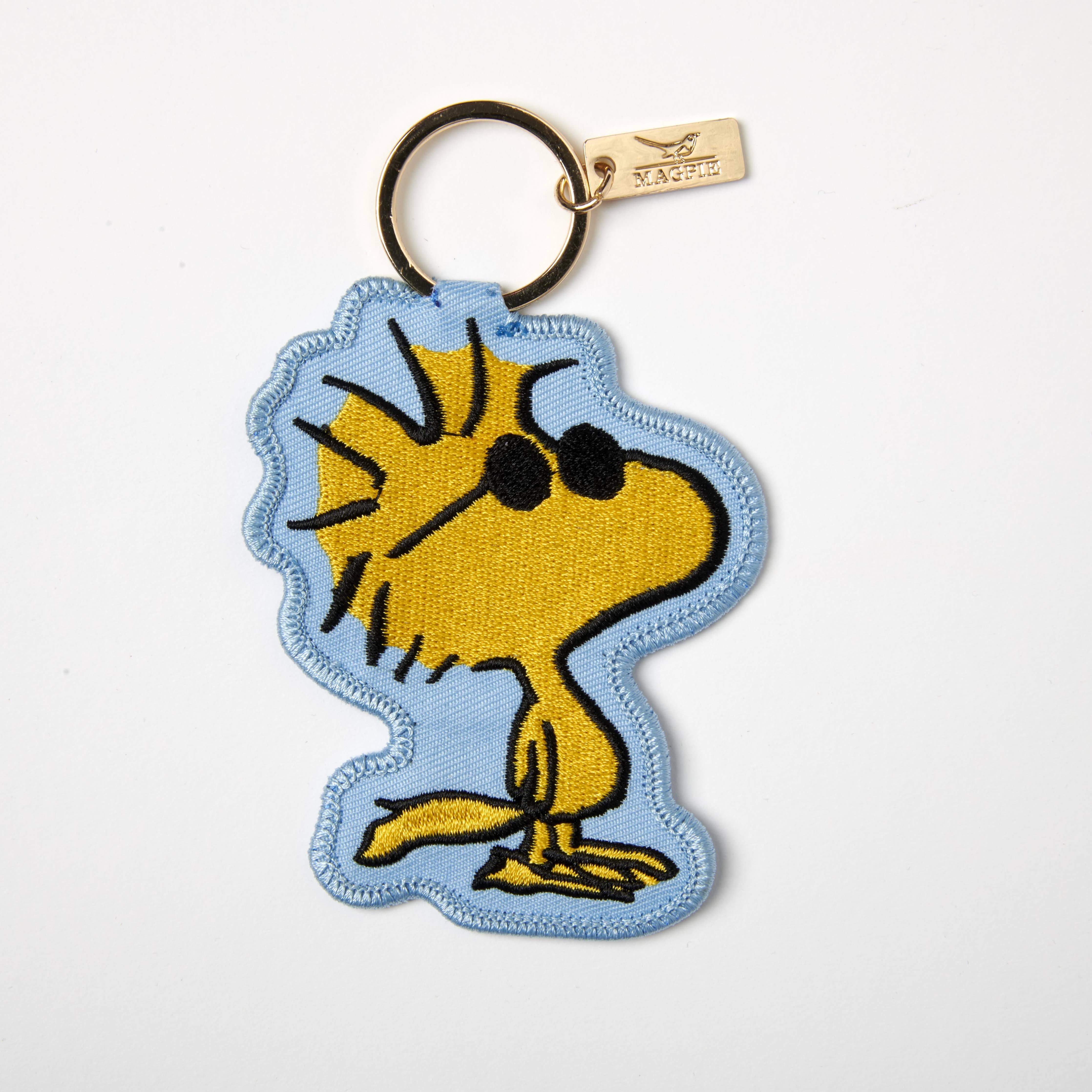 Embroidered Woodstock keychain in classic style, with Woodstock wearing sunglasses.