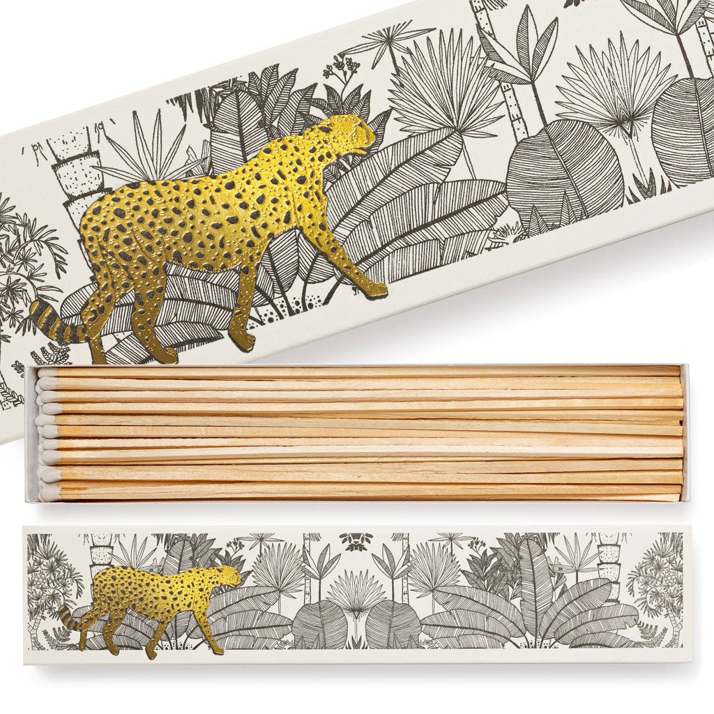 A long matchbox featuring a cheetah in a white jungle.