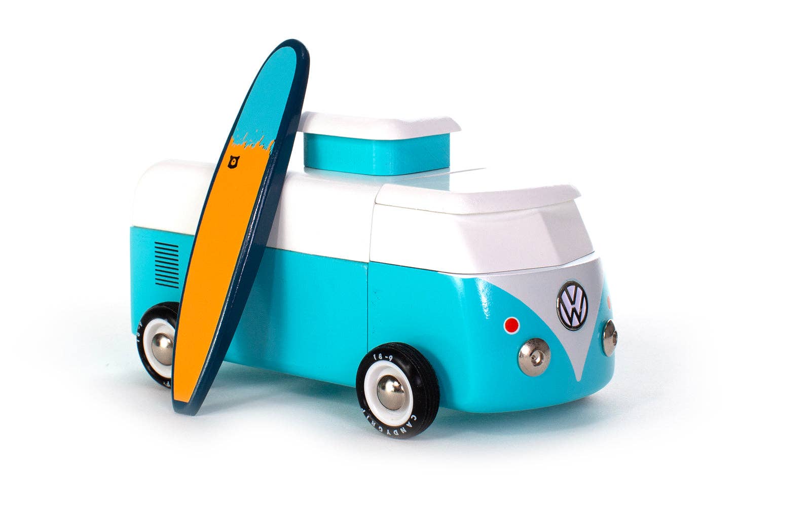Toy van with a surfboard on a white background