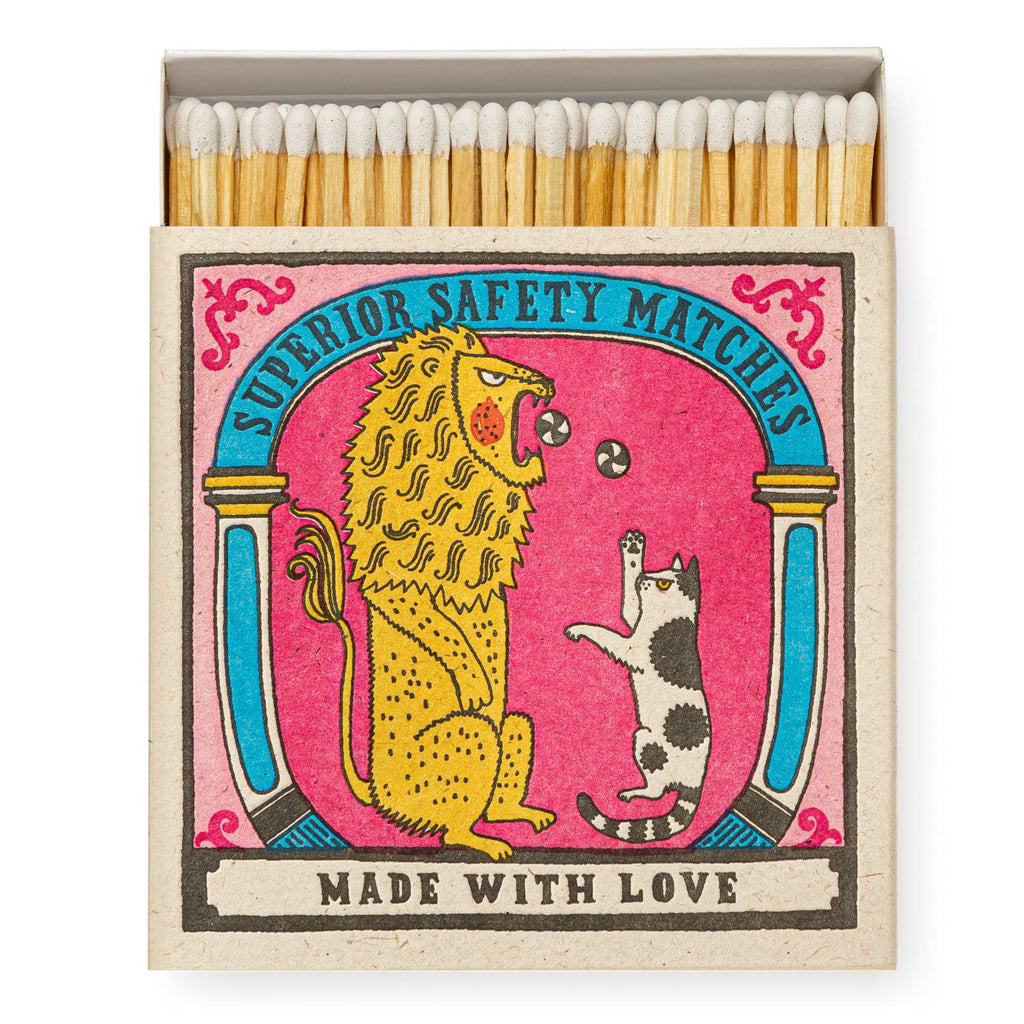 A square matchbox featuring a big cat and a little cat on its cover.