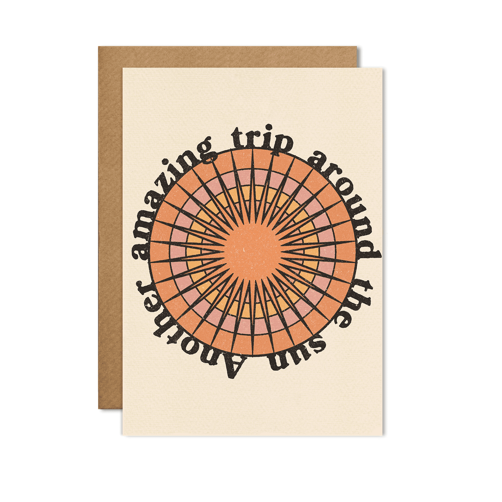 A greeting card with a retro-style sunburst design and the phrase "Another amazing trip around the sun" in bold, circular text.