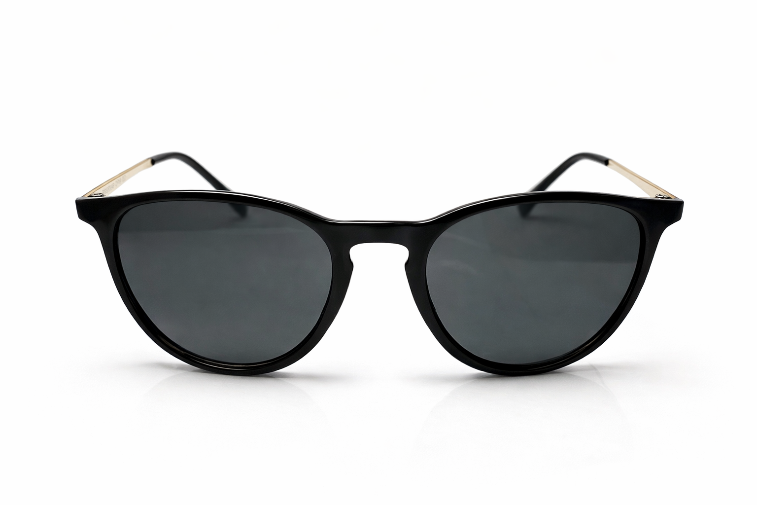 Black sunglasses with gold accents on a white background