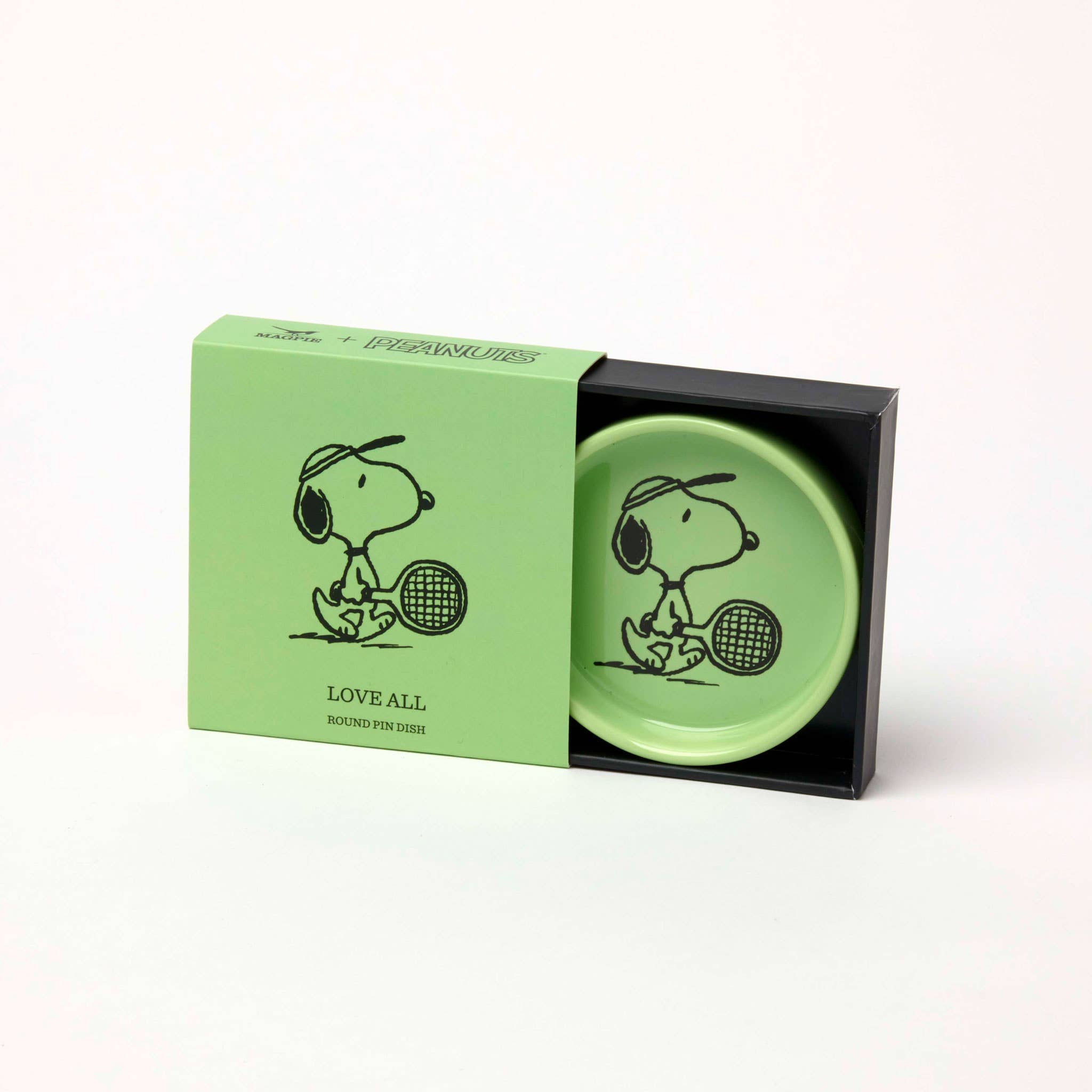 Green Snoopy pin dish with Snoopy holding a tennis racket.
