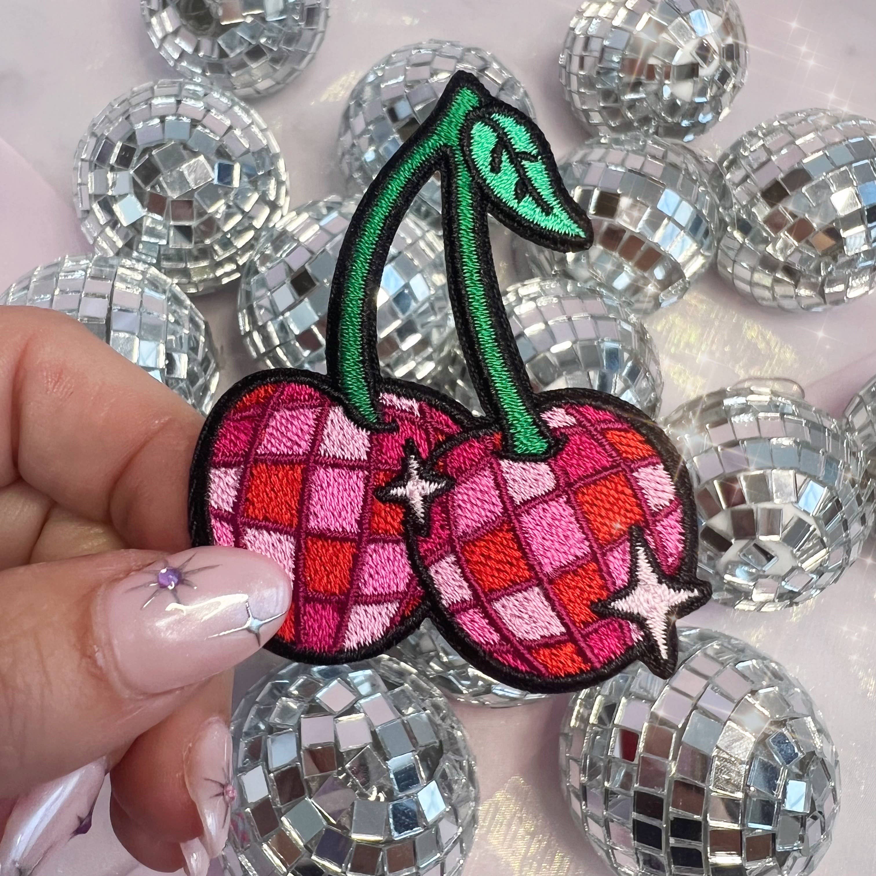 Disco Ball Cherries Patch featuring a pair of cherries designed as shiny disco balls.