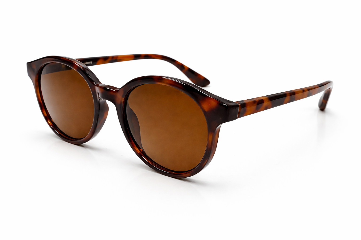 Sunglasses with tortoiseshell frame and brown lenses on a white background