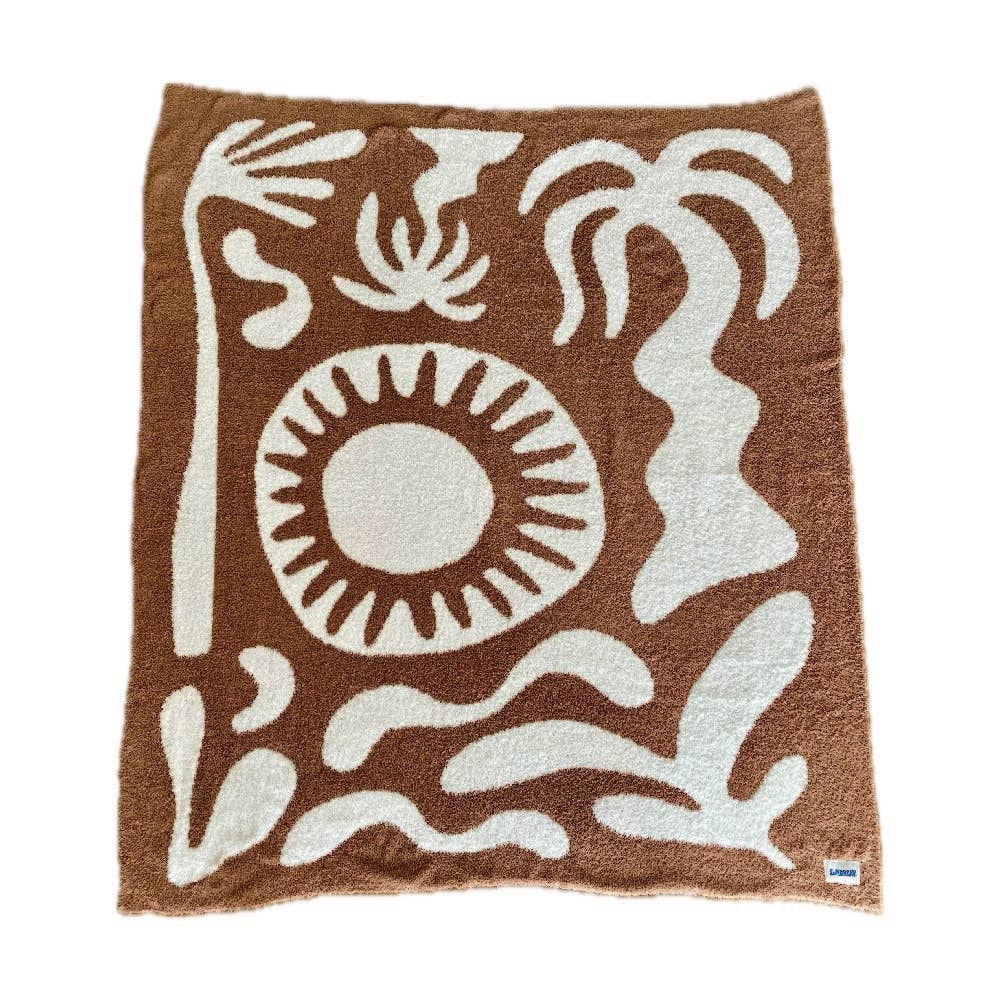 Soft brown plush throw blanket with a sun and palm tree design, perfect for adding warmth and a stylish accent to any space.
