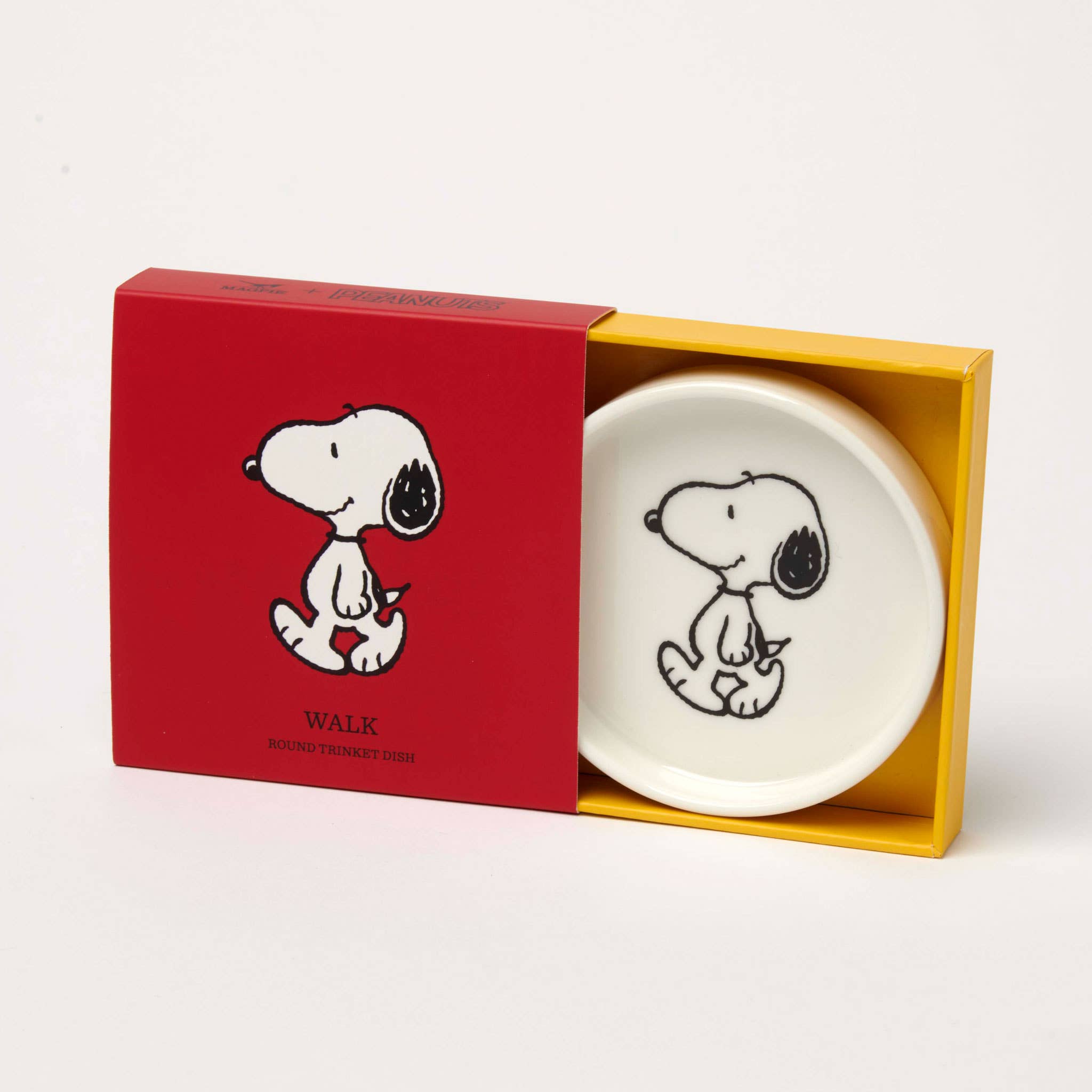 Round ceramic trinket dish with a black-and-white illustration of a walking beagle, packaged in a red and yellow gift box.