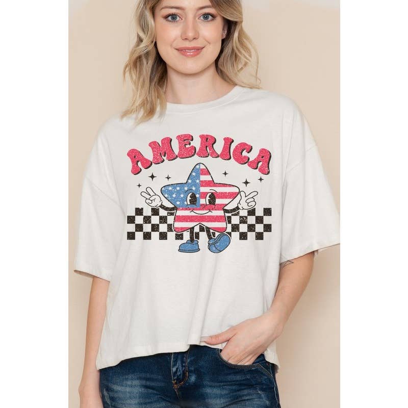 Woman wearing an oversized graphic T-shirt with an “America” star design and checkered details.