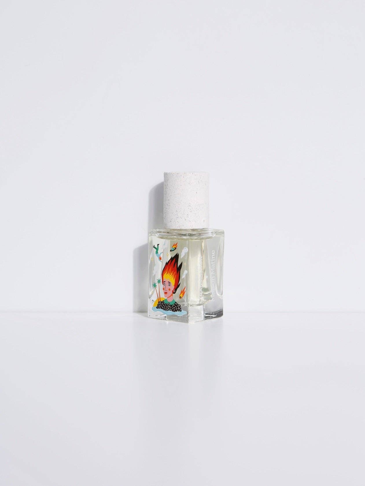 Maison Matine Lost in Translation perfume bottle with bold illustrated design, placed on vibrant yellow textured surface.