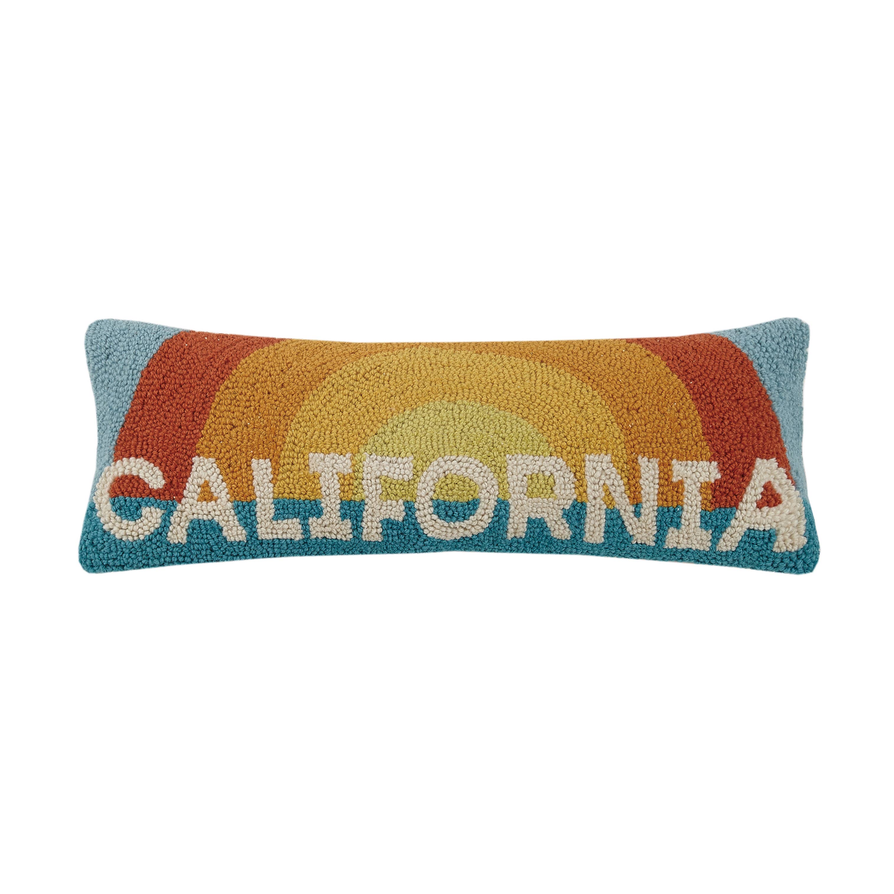 California Sun hook pillow with a retro sunburst design in orange, yellow, and blue, and "California" text in bold white letters.
