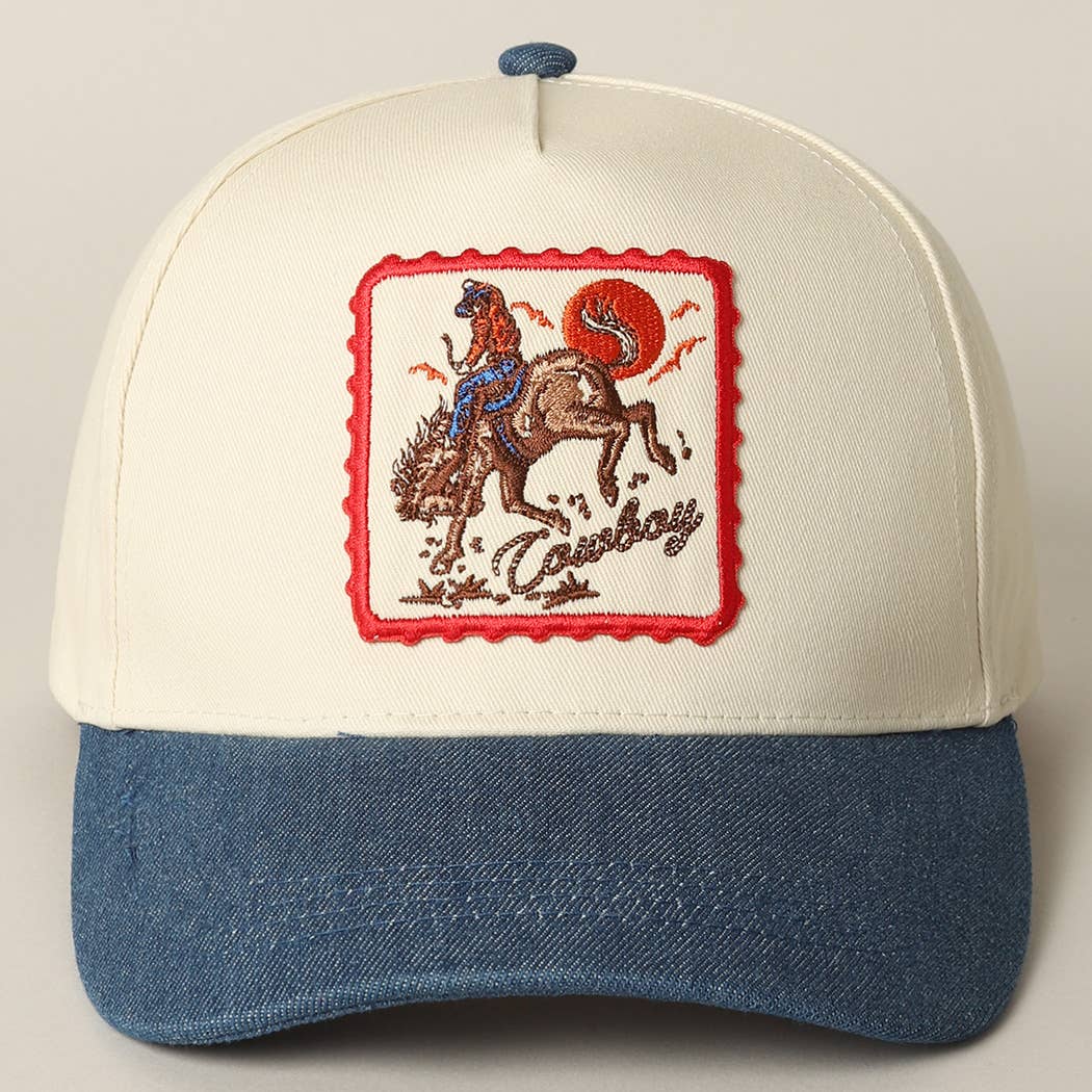 Cap with embroidered design of a cowboy on a horse, red border, and blue and white color scheme.