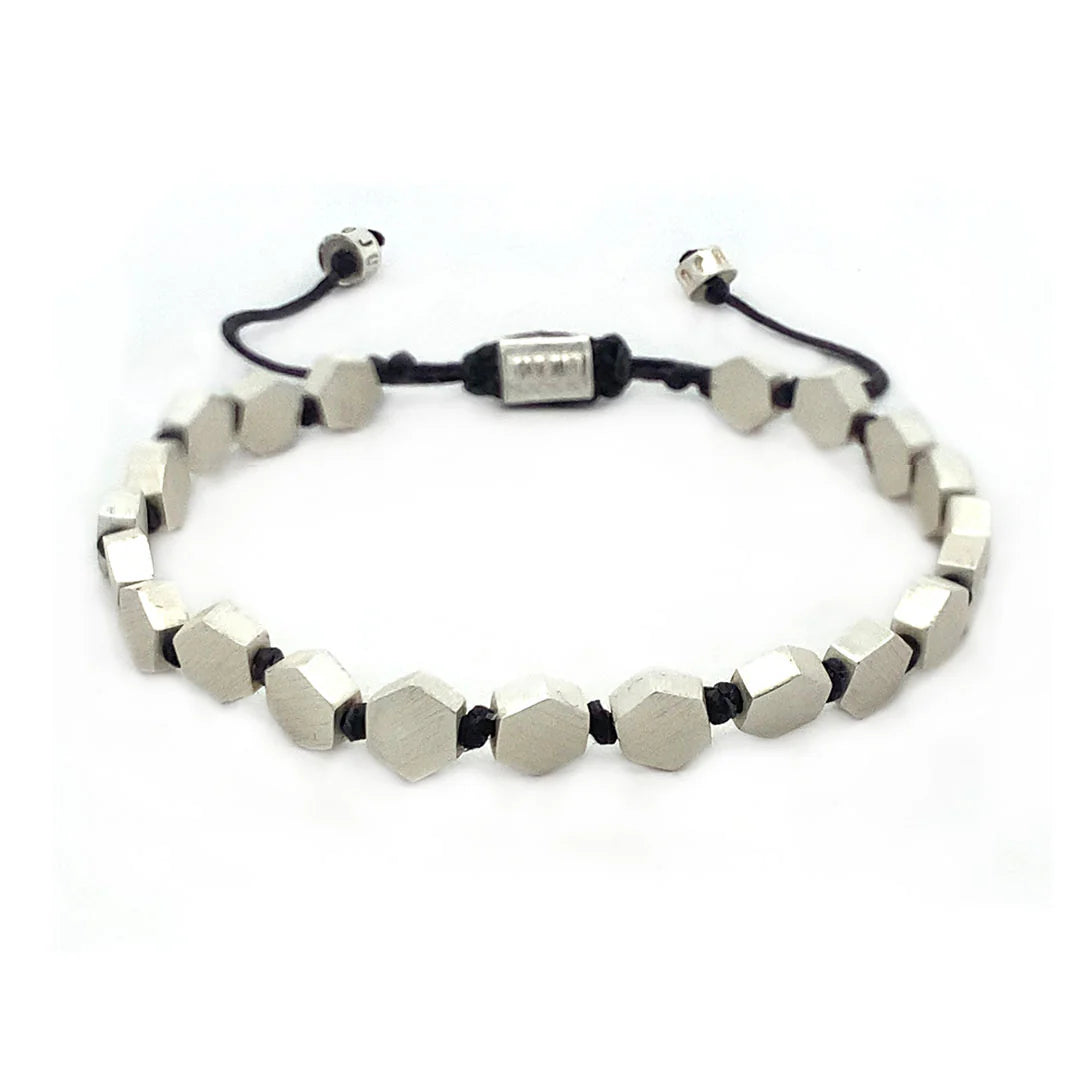 Adjustable bronze bracelet with geometric design, featuring a mix of bronze and black components.