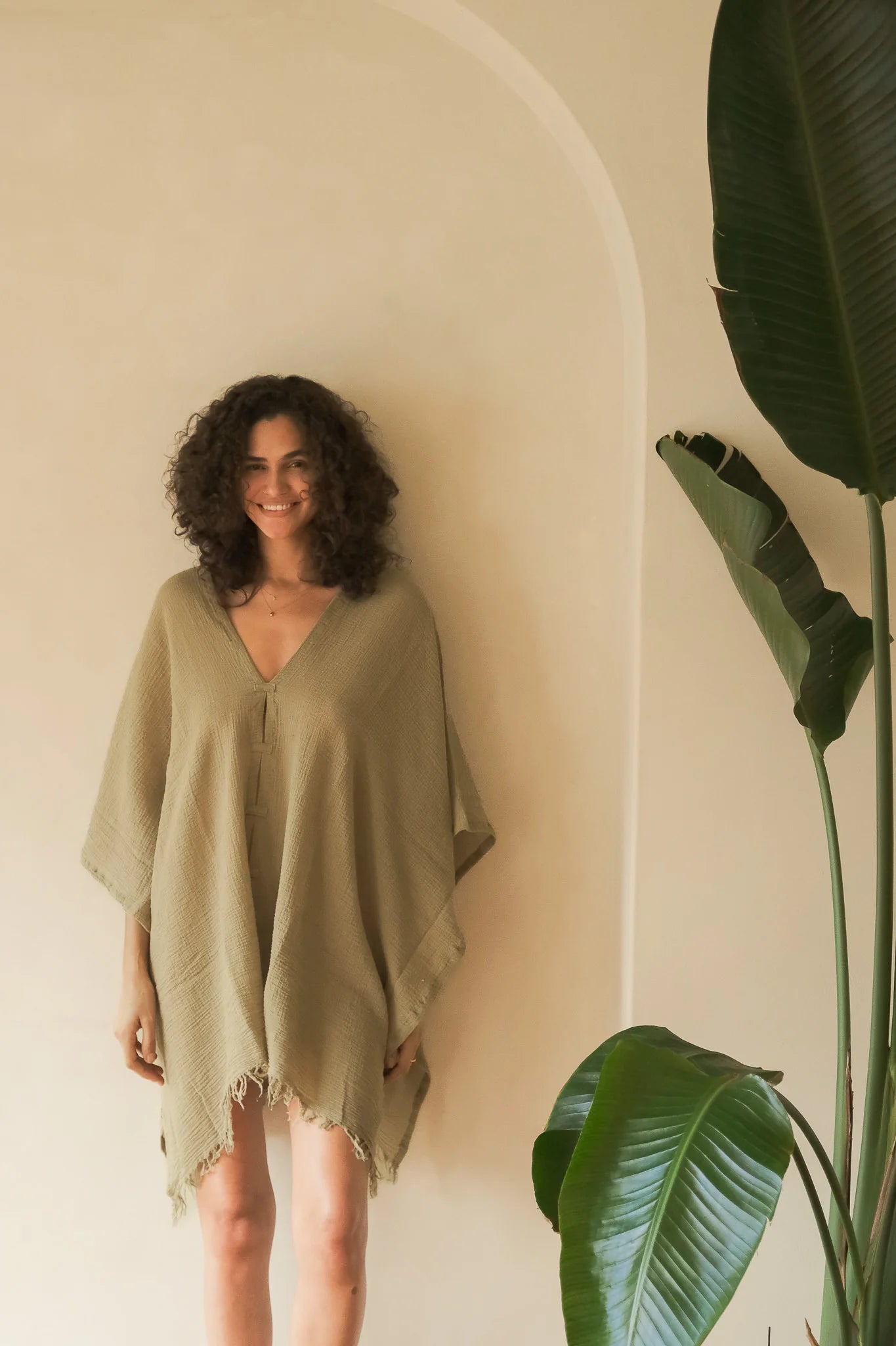 A woman gracefully wearing the Ava Kimono, showcasing its flowing silhouette, delicate patterns, and high-quality fabric.