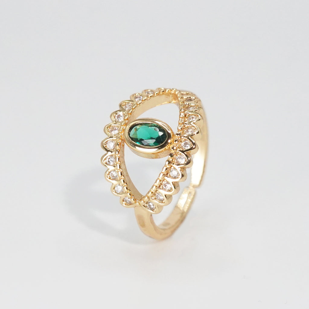 Glenneyre Ring: Eye-shaped design with shimmering stones and a striking green centerpiece, epitome of allure.
