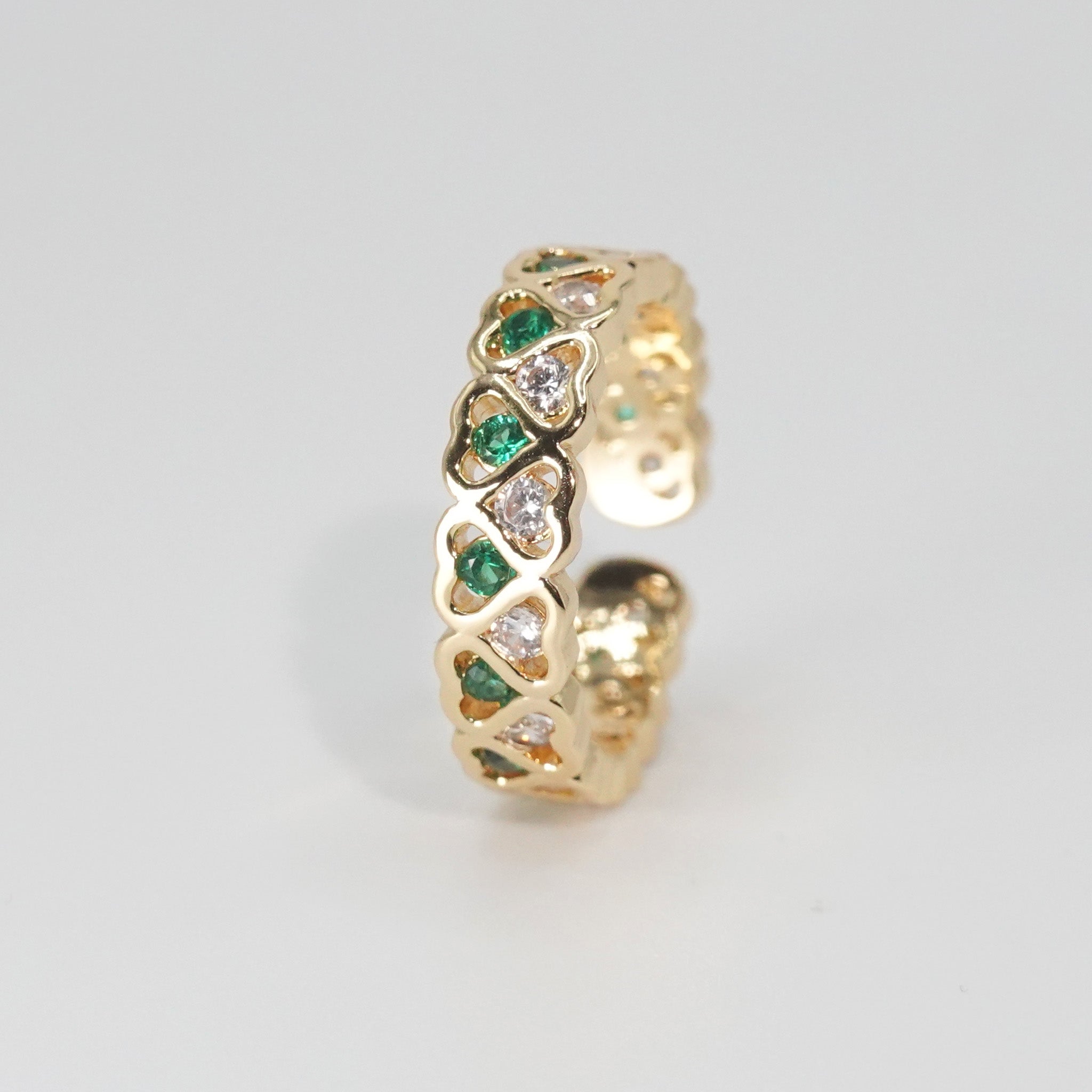 Lagoon Ring: Heart-shaped designs with shimmering stones and vibrant green accents, epitome of romance.