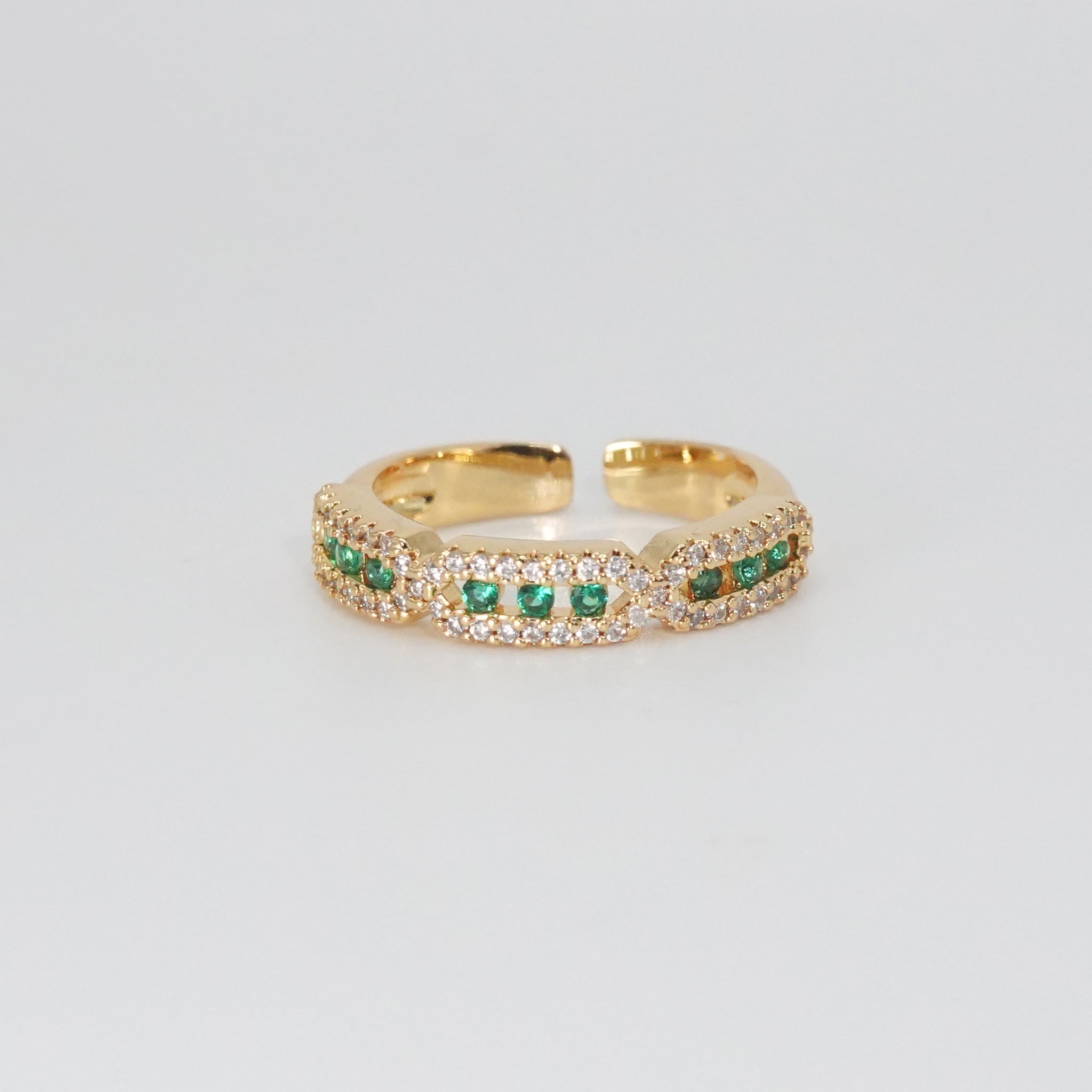 Calliope Ring: A captivating mix of green and shimmering stones, epitome of enchantment.