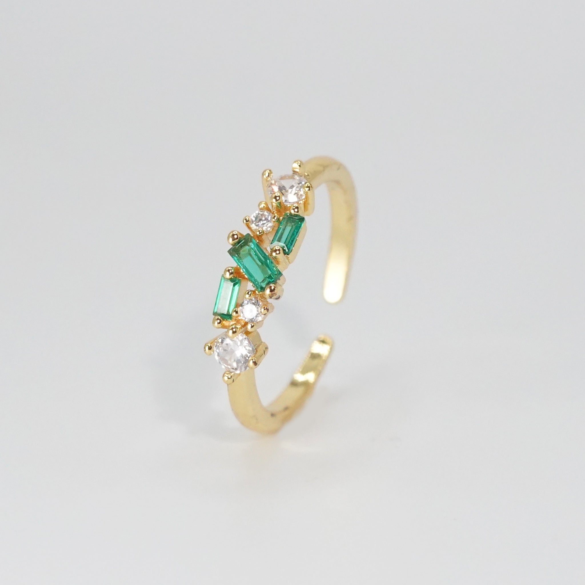 Cypress Ring: A dazzling array of shiny and green stones, epitome of opulence.