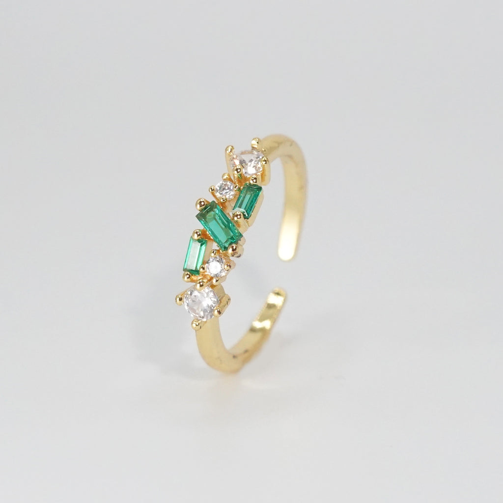 Cypress Ring: A dazzling array of shiny and green stones, epitome of opulence.