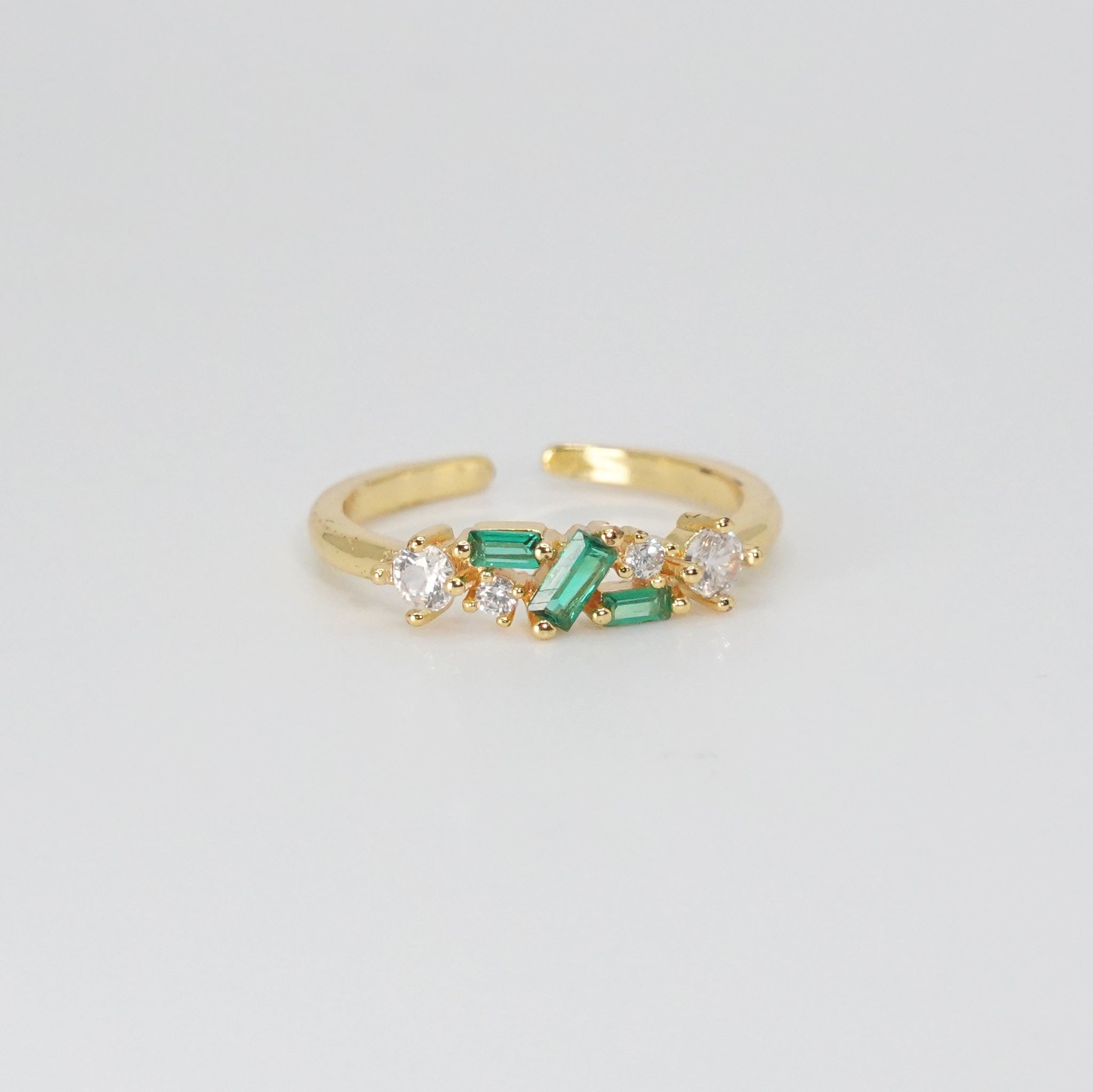 Cypress Ring: A dazzling array of shiny and green stones, epitome of opulence.