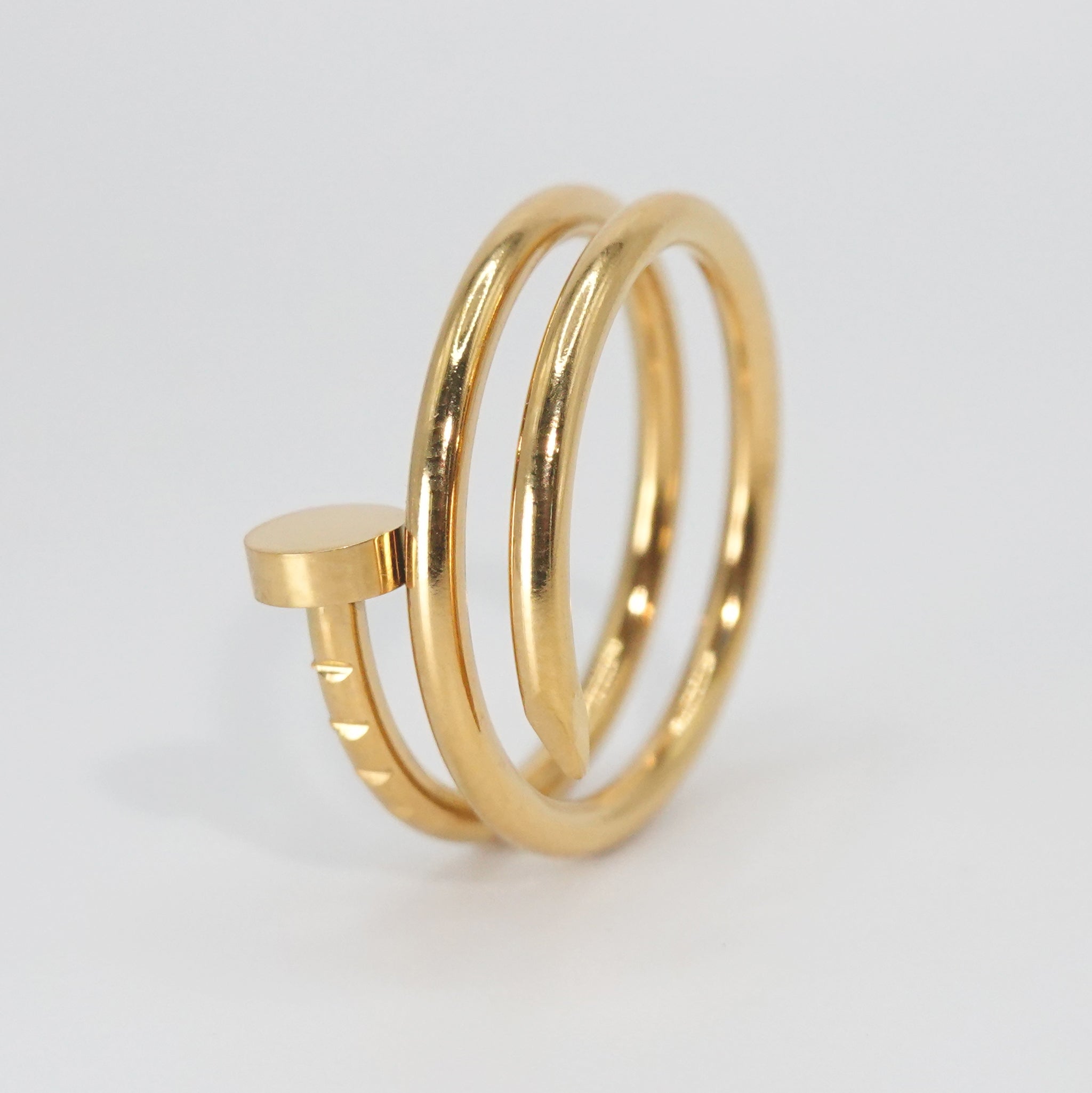 Garnet Ring: Striking nail-shaped design, adding edgy glamour to any outfit.