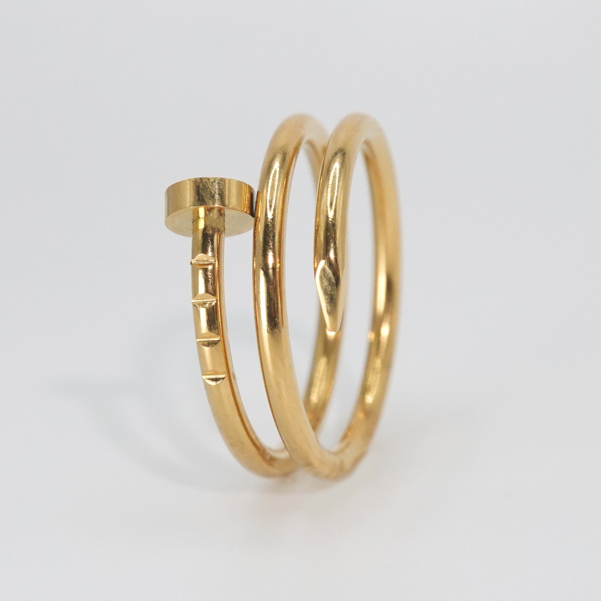 Garnet Ring: Striking nail-shaped design, adding edgy glamour to any outfit.