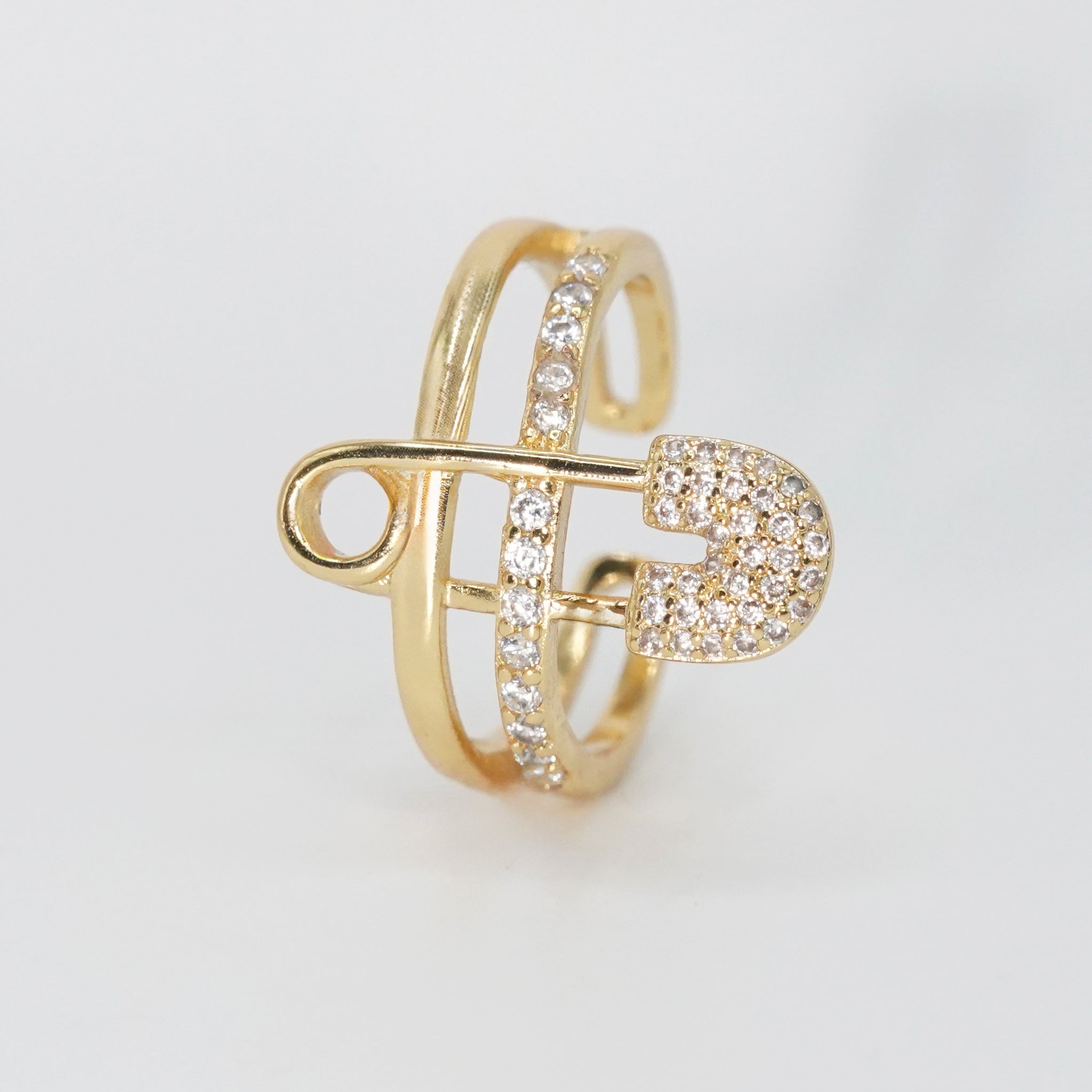 Decker Ring - Sterling silver ring with safety pin design and sparkling stones.