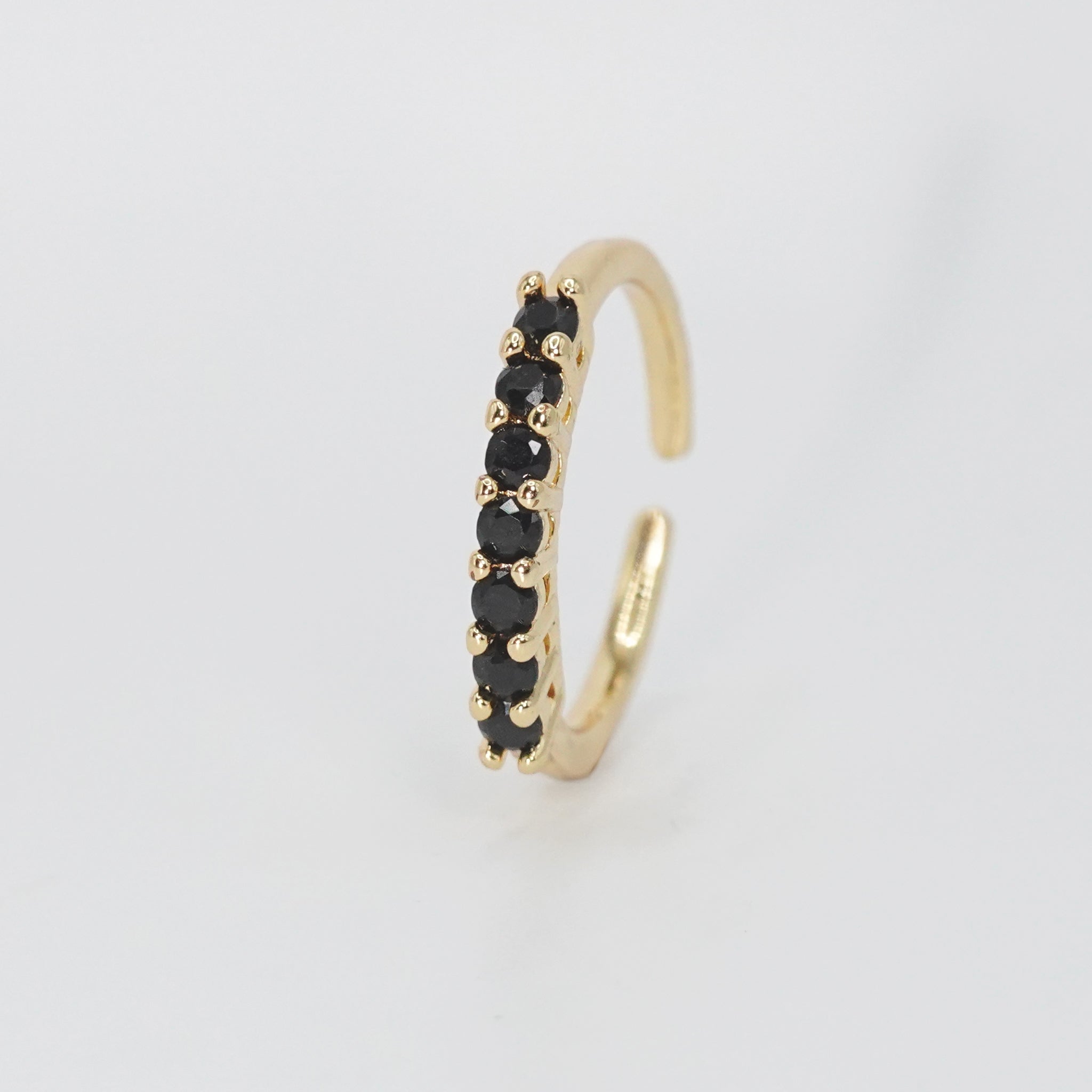 Puerco Ring - Sleek ring adorned with striking black stones.