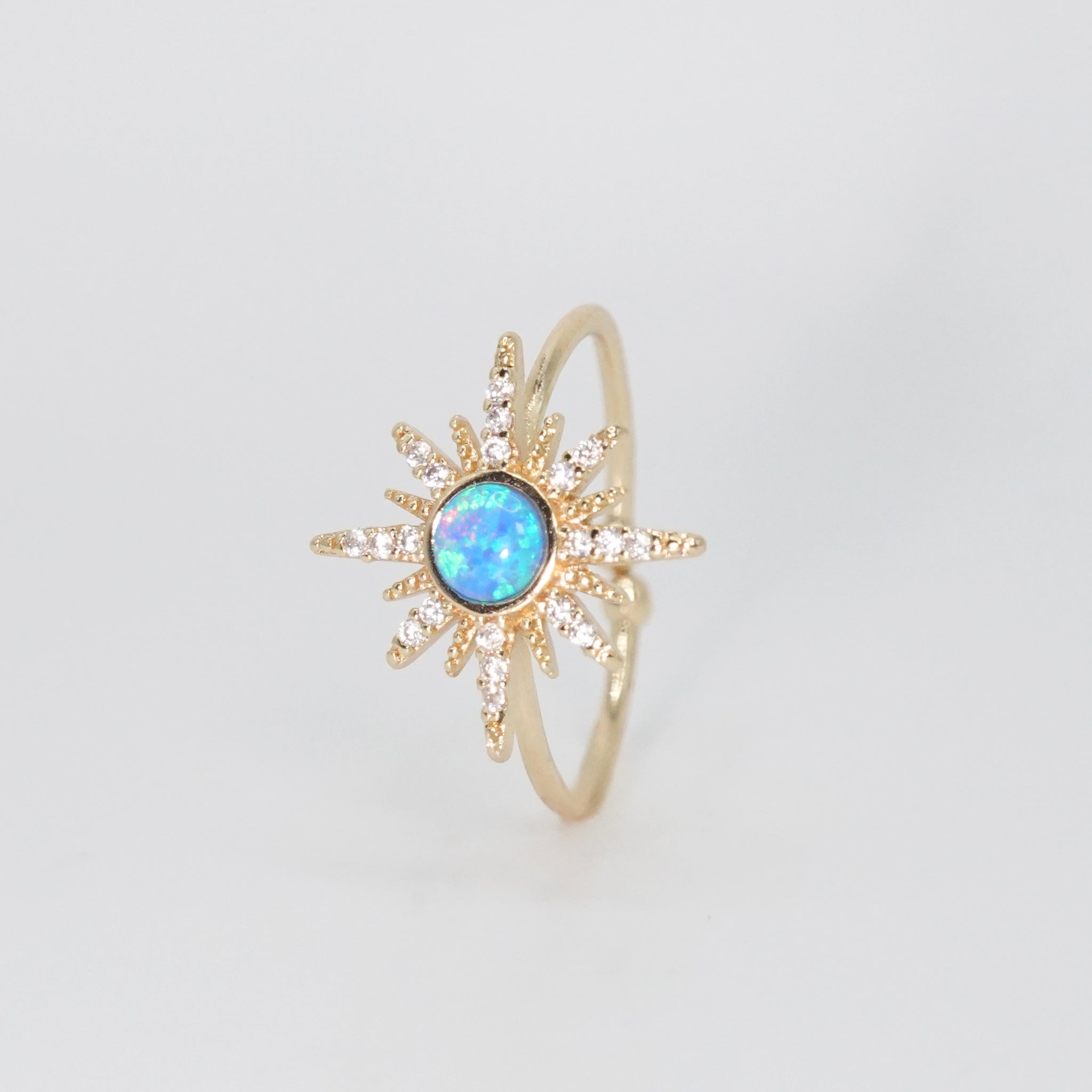Cavalleri Ring - Opal center surrounded by a star motif in silver.