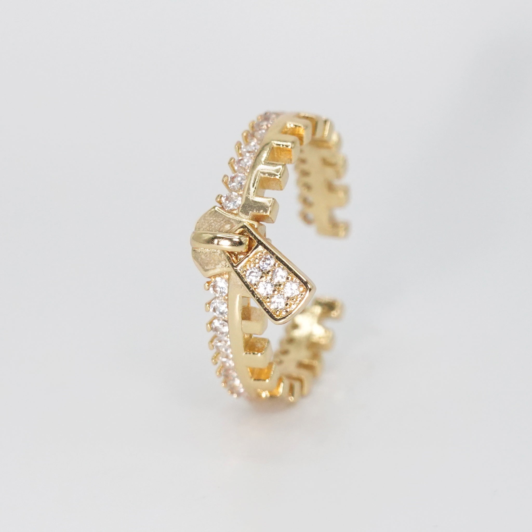 Reefer Ring - Zipper-shaped design with shiny stones.
