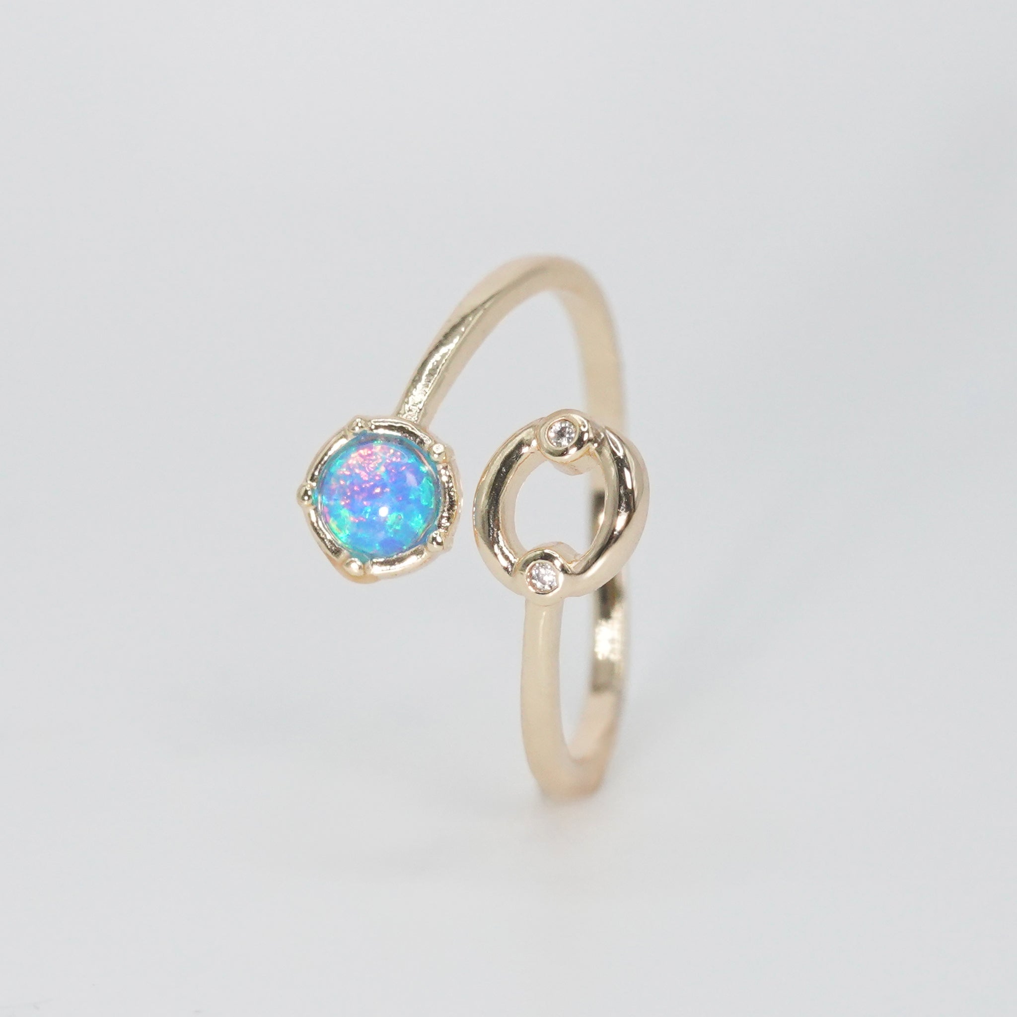 Cancer Ring: Crab symbol with shimmering stones surrounding an opal, embodying emotional depth.