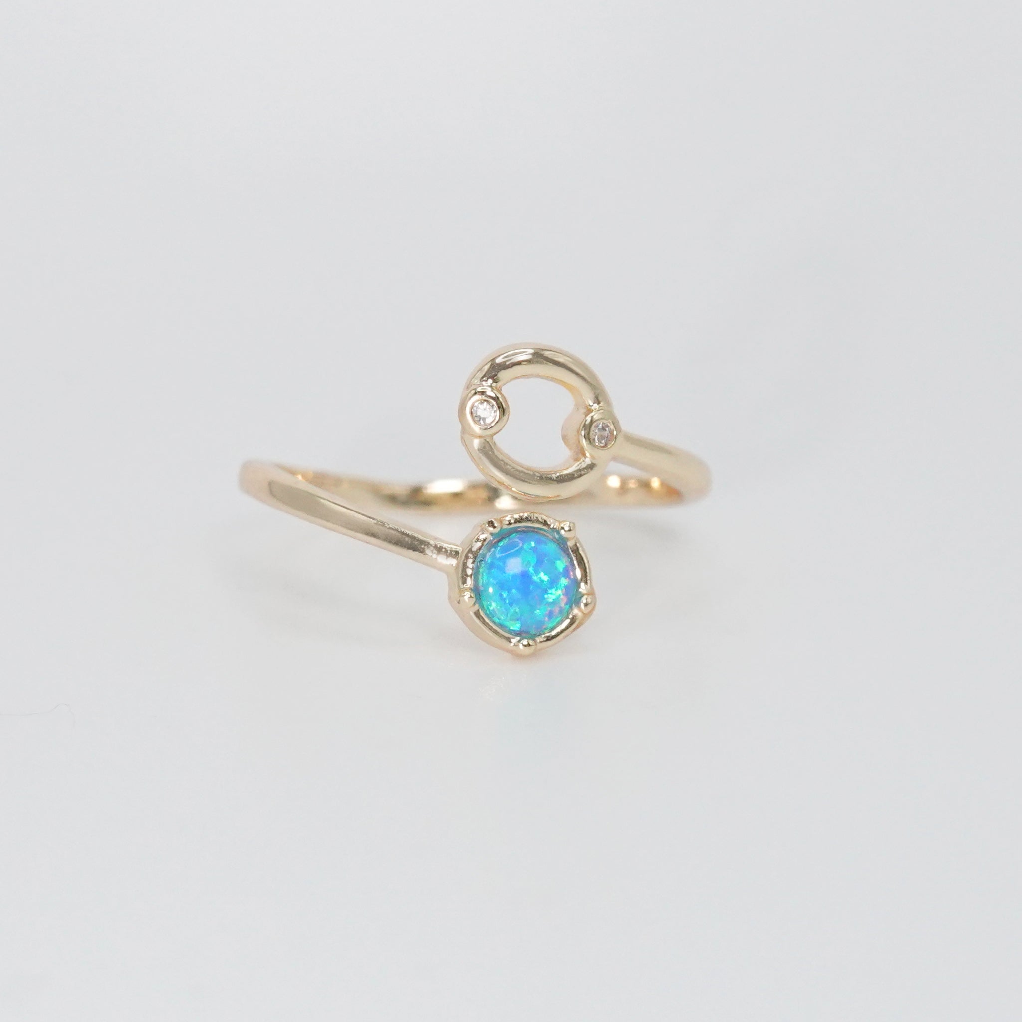 Cancer Ring: Crab symbol with shimmering stones surrounding an opal, embodying emotional depth.
