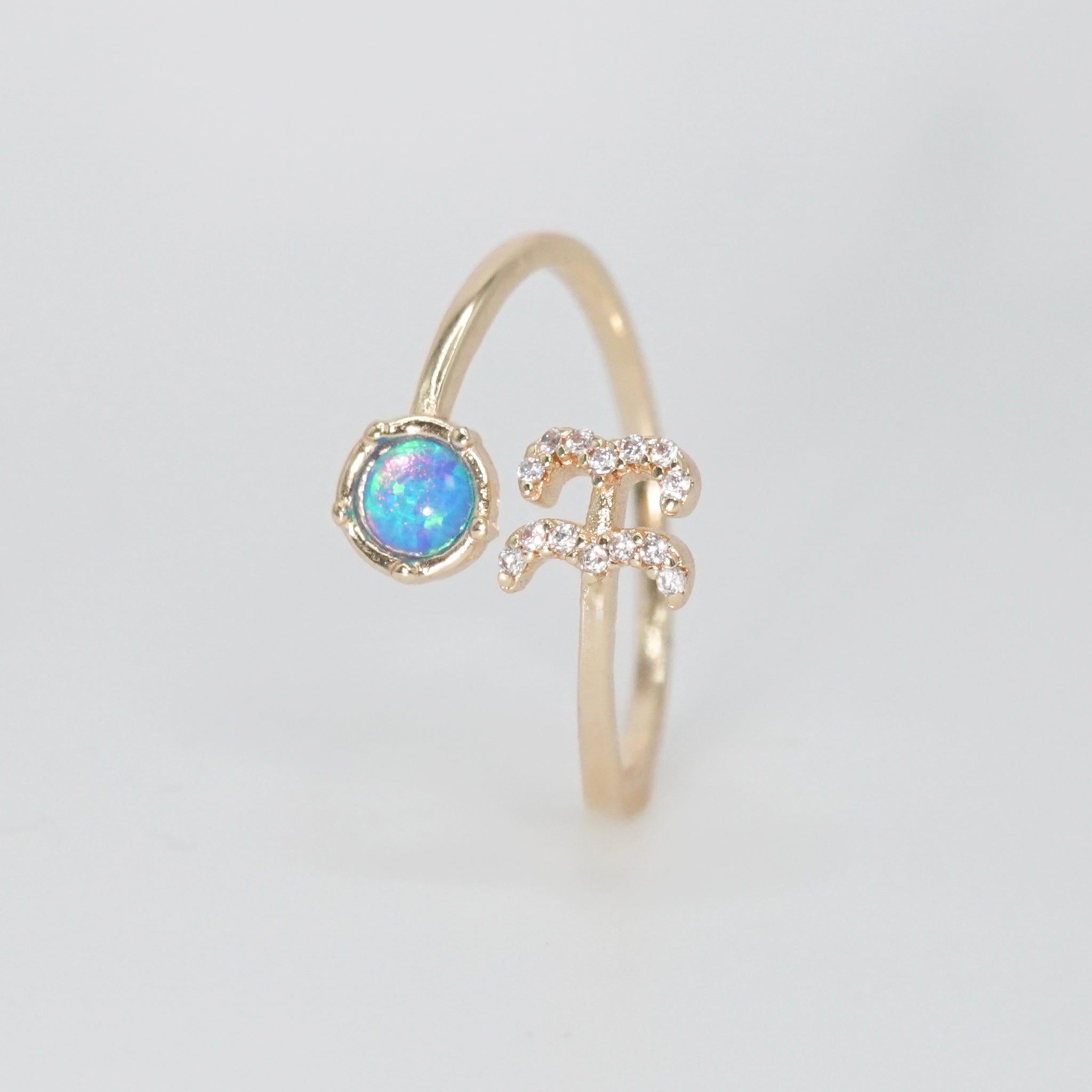 Aquarius Ring: Water symbol in opal and shimmering stones, epitome of individuality.