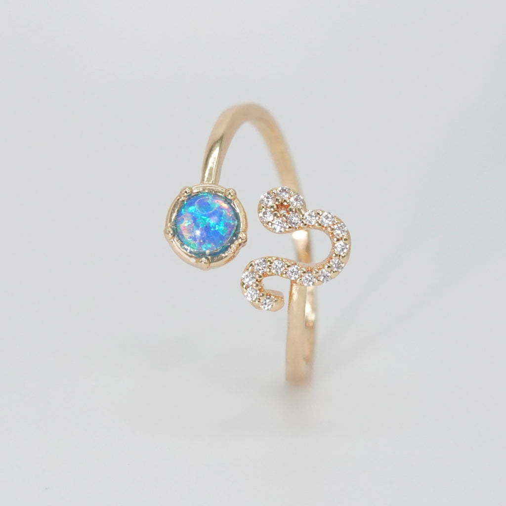 Leo Ring: Lion symbol with shimmering stones surrounding an opal, epitome of confidence.