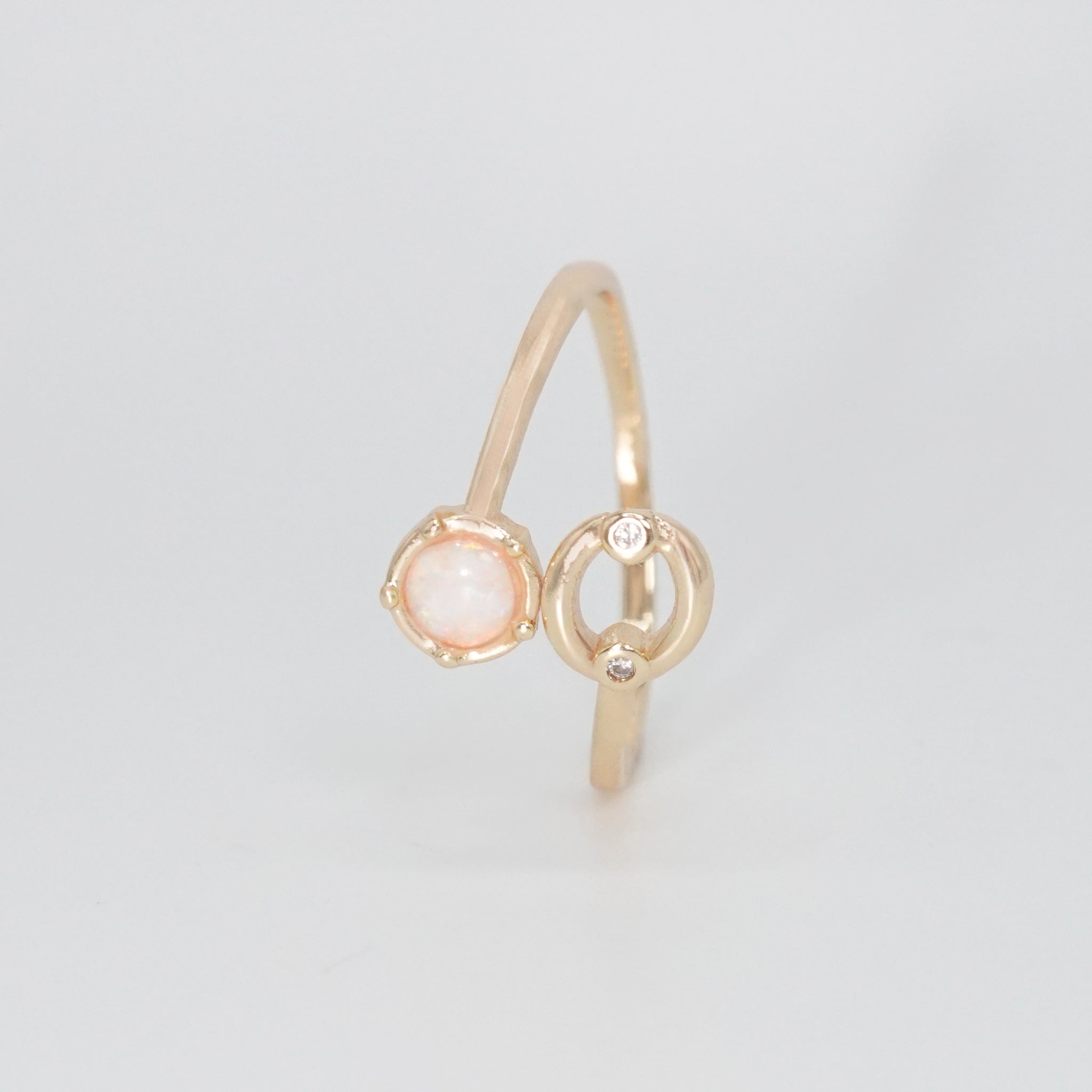 Cancer Ring: Crab symbol with shimmering stones surrounding an opal, embodying emotional depth.