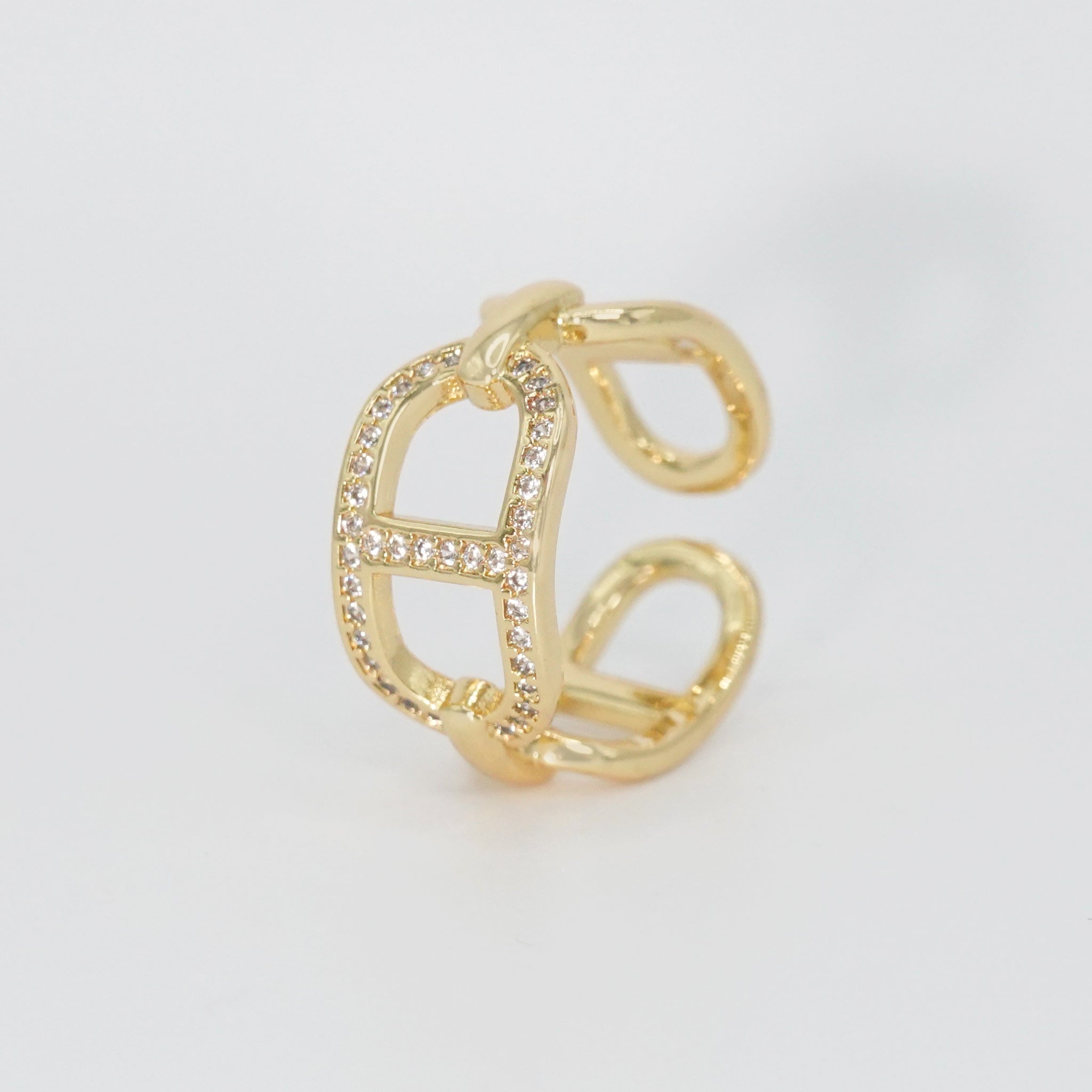 Mabery Ring: Adorned with dazzling shiny stones, exuding elegance and sparkle.