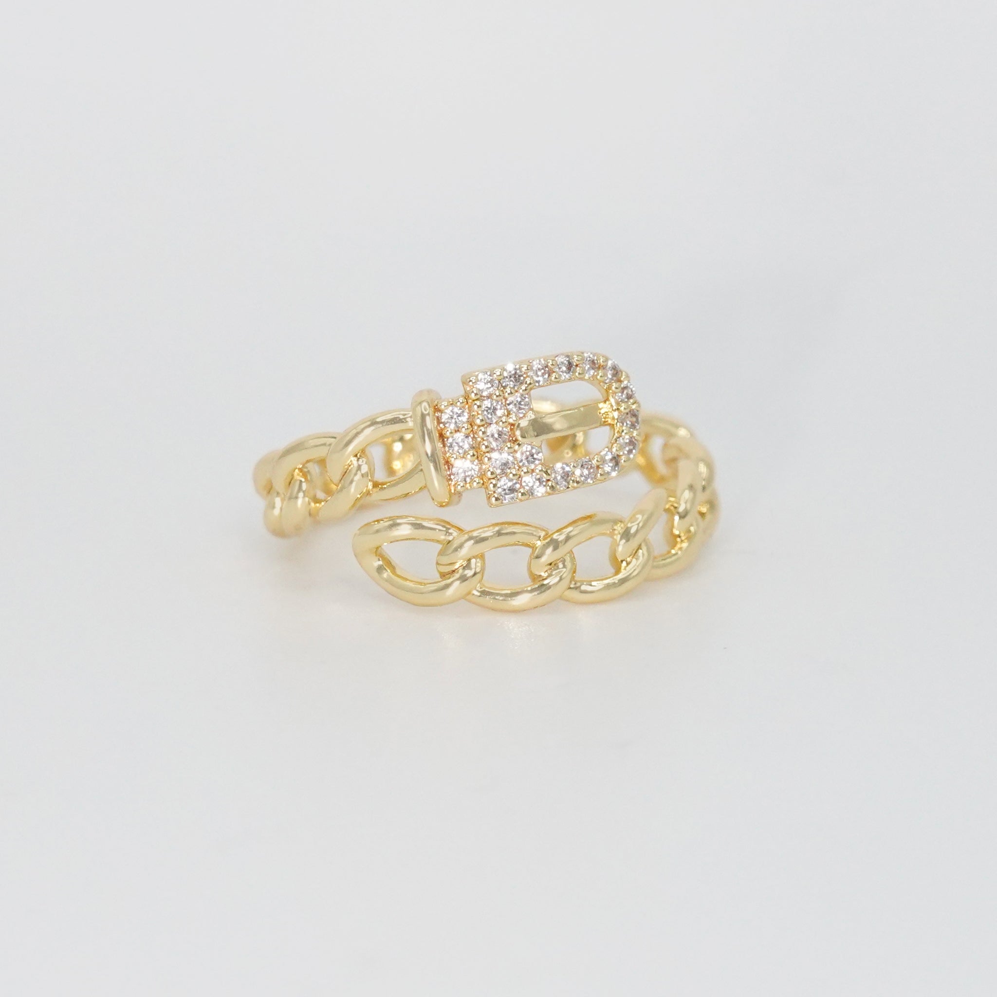 Radcliffe Ring: Chic chain and belt design adorned with dazzling stones, epitome of modern elegance.