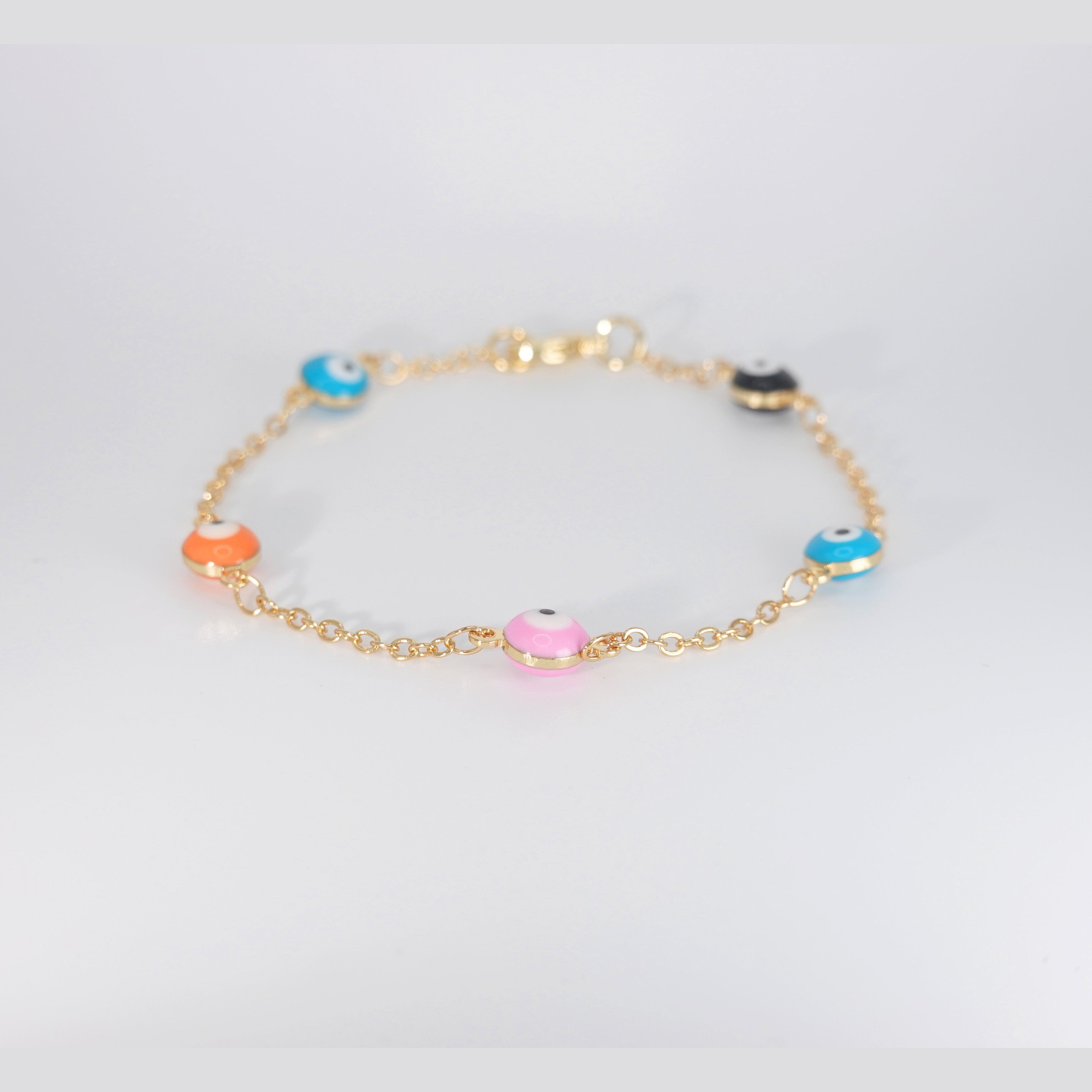 Poppy Bracelet: Vibrant evil eye charms for protection and mystique, epitome of eclectic charm.