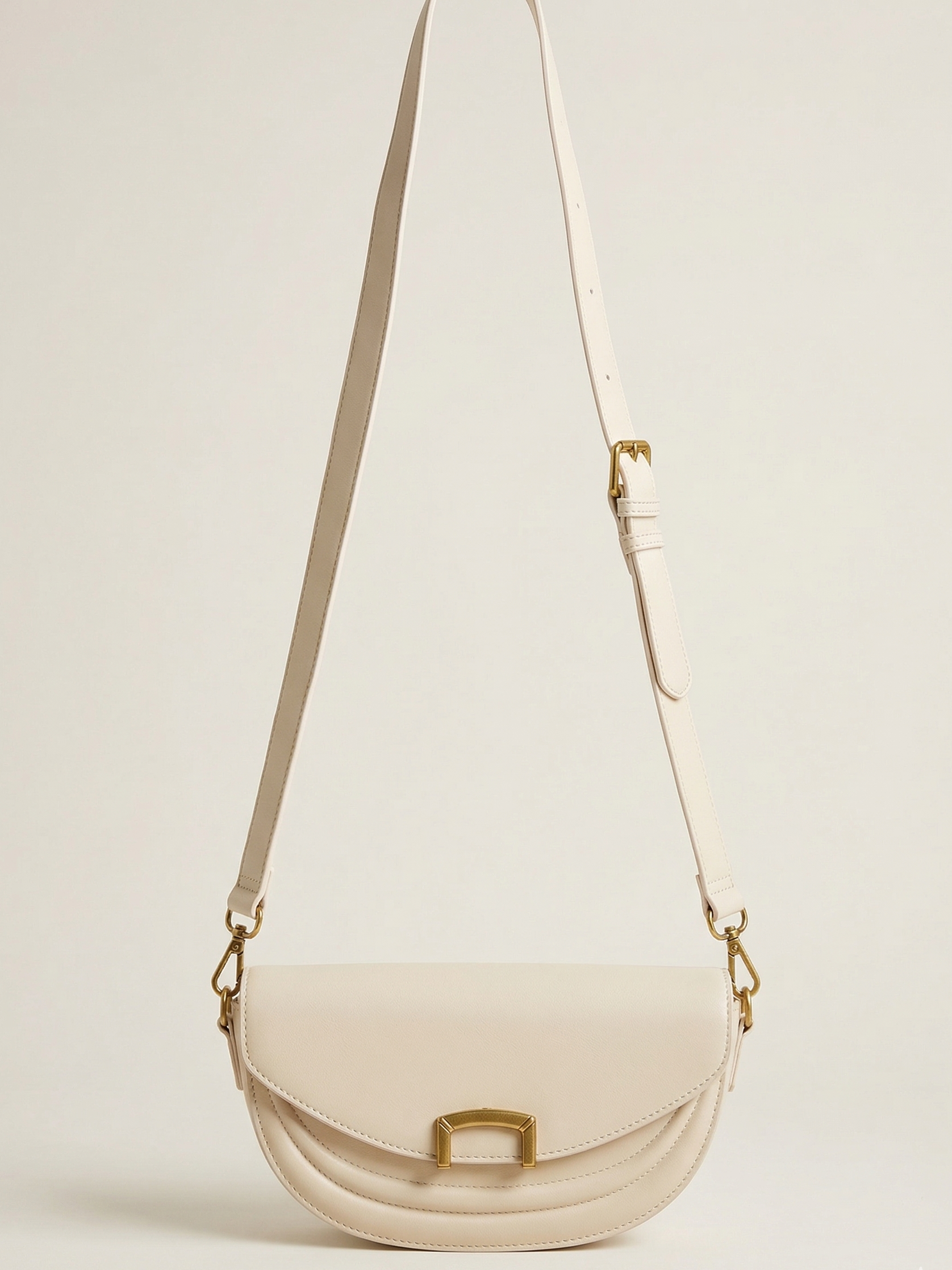 Beige handbag with a transparent section on a light beige background