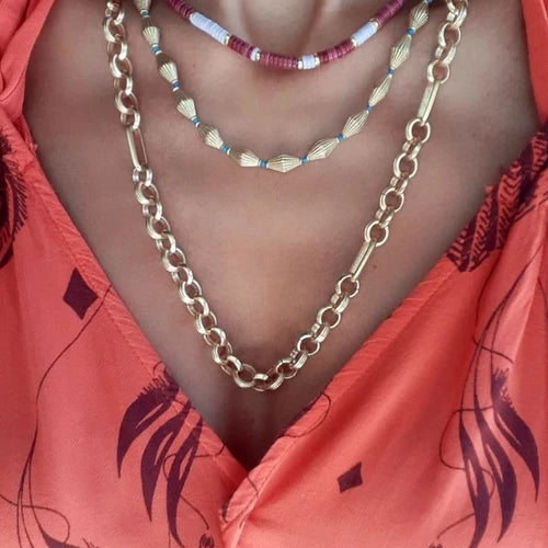Bari Necklace: A coastal-inspired beauty, this necklace combines boho elegance with beachy vibes. The intricately crafted charms capture the essence of sun-soaked days, adding a touch of laid-back allure to your look.
