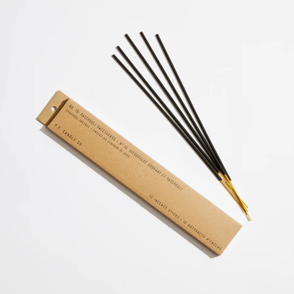 Bundle of Patchouli Sweetgrass Incense sticks in a natural setting, highlighting the earthy, fresh fragrance of the product.